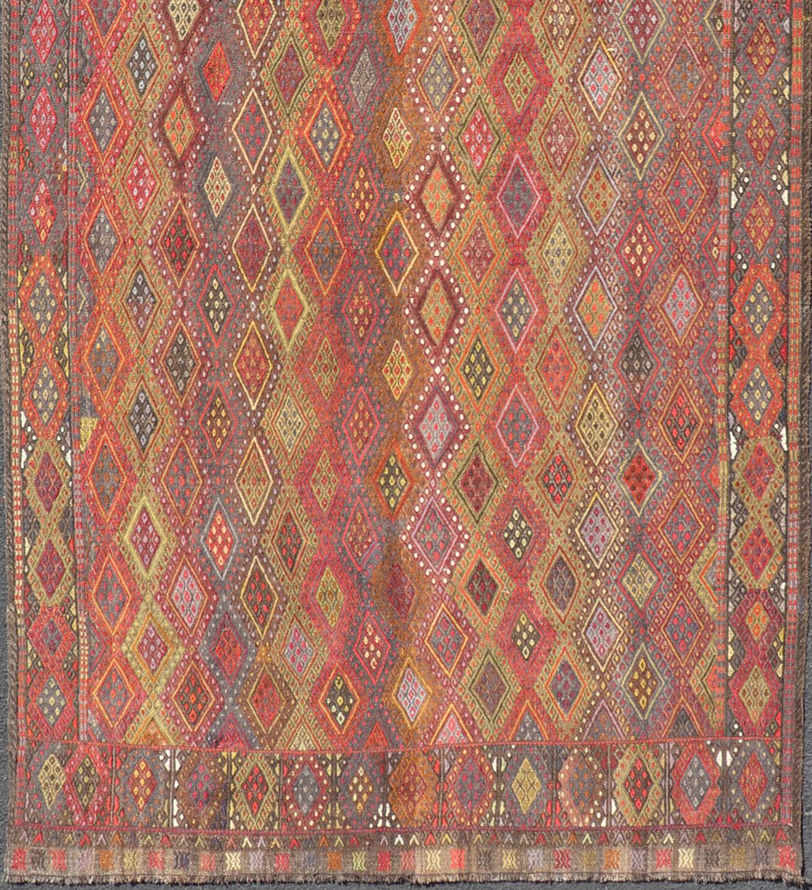 Vintage Turkish Gallery Kilim with All-Over Diamond Design in Multicolor. Vintage Turkish Gallery Kilim, Keivan Woven Arts / rug EN-P13788, country of origin / type: Turkey / Kilim, circa Mid-20th Century.
Measures: 5'0 x 13'0.
Woven during the