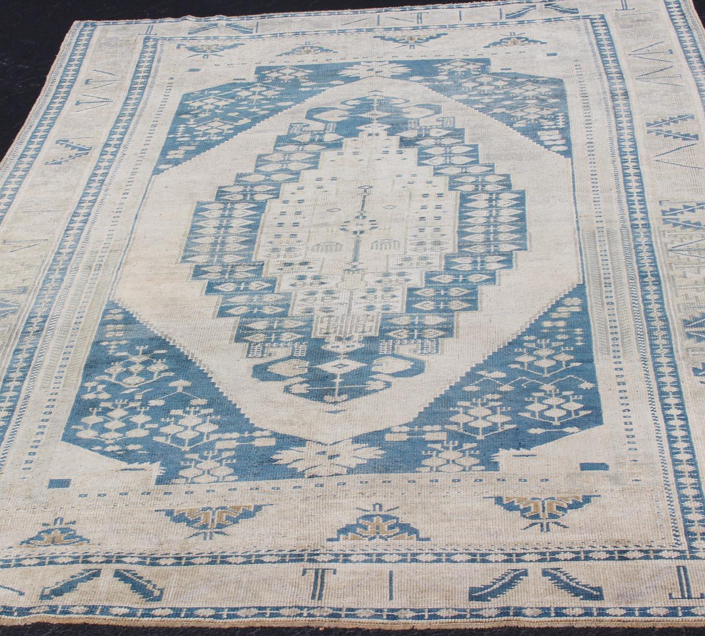 20th Century Vintage Turkish Hand Knotted Oushak Rug with Central Medallion in Blue and Cream For Sale