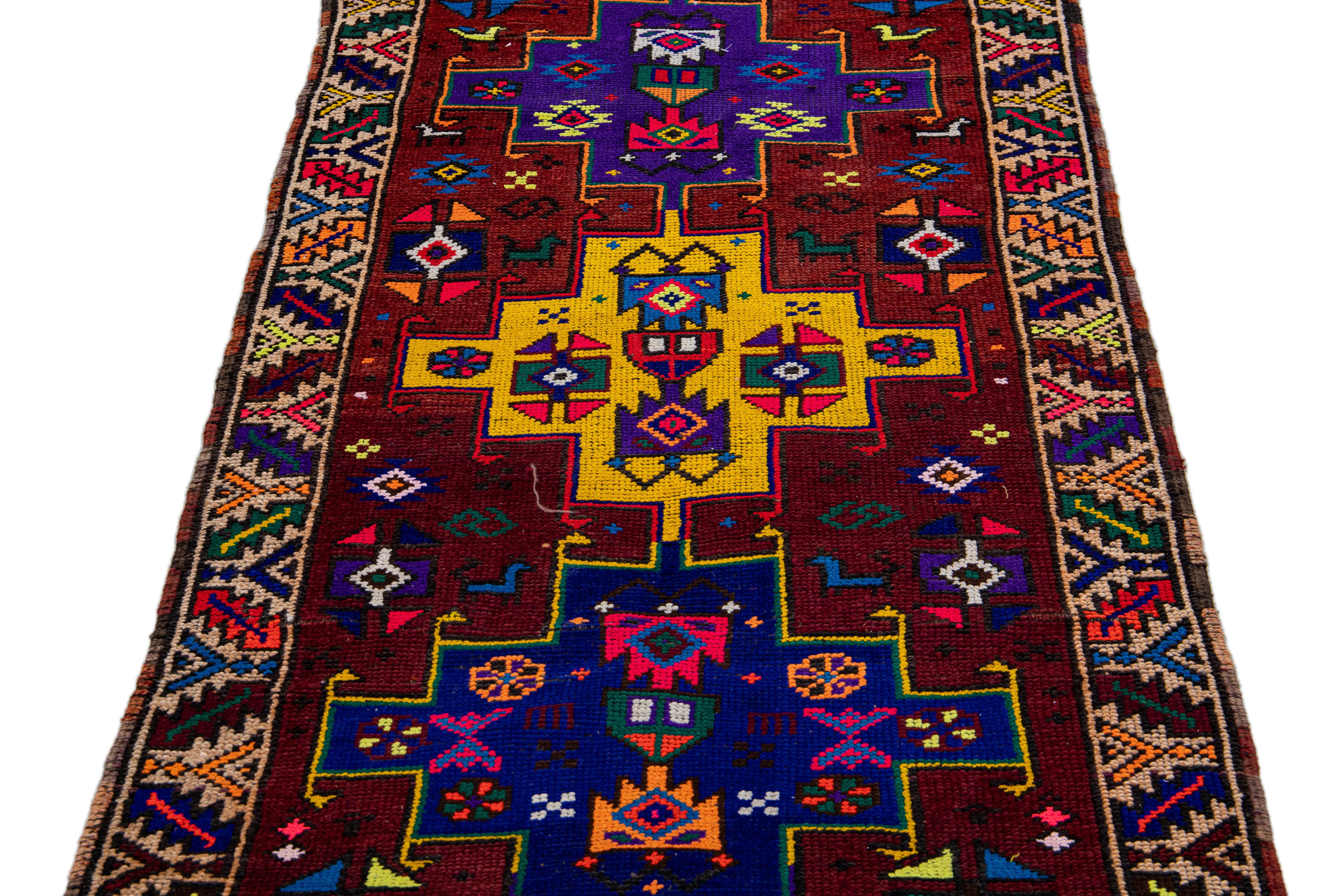 Mid-Century Modern Vintage Turkish Handmade Multicolor Tribal Pattern Burgundy Wool Runner For Sale