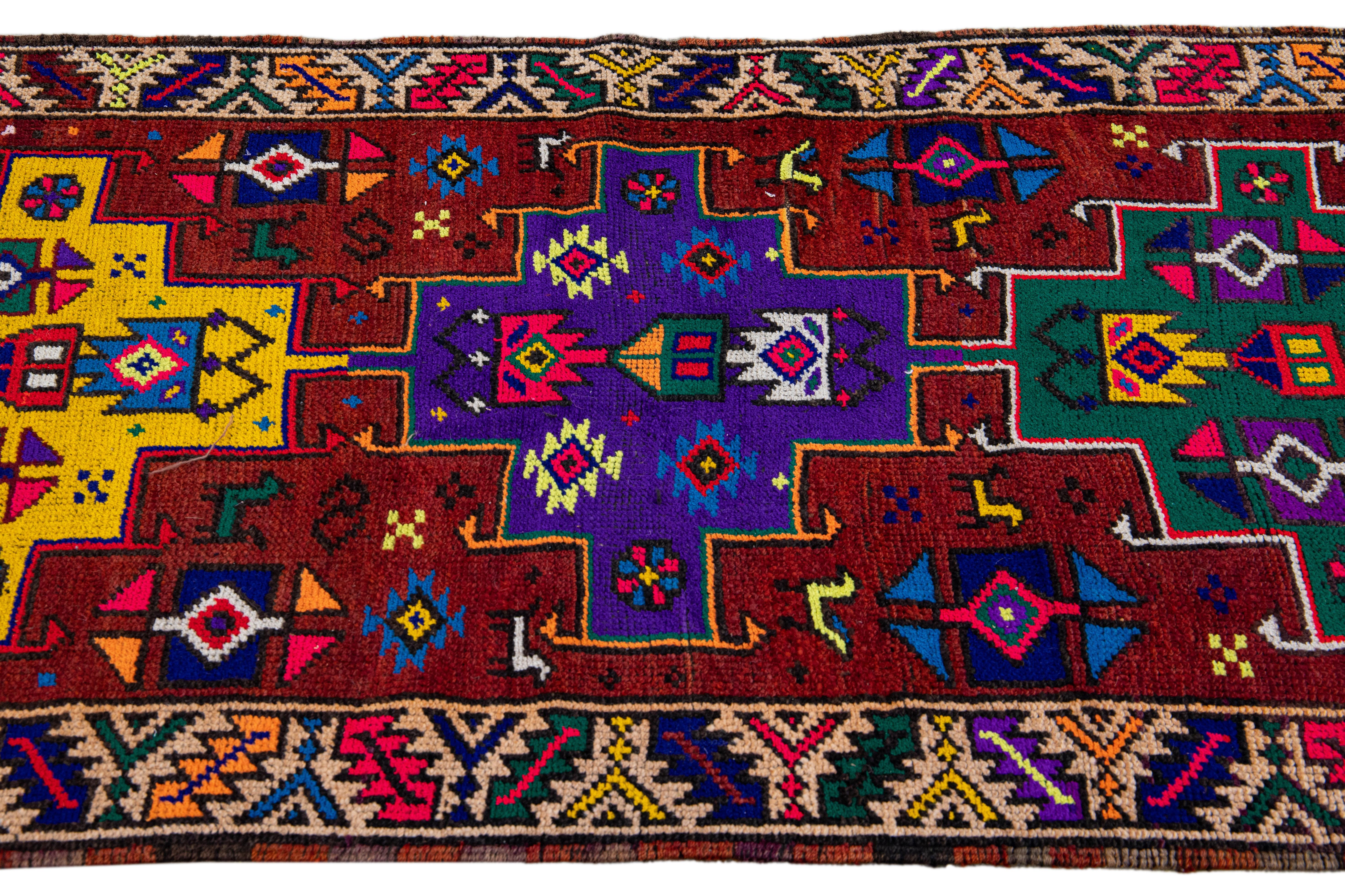 Vintage Turkish Handmade Multicolor Tribal Pattern Burgundy Wool Runner In Excellent Condition For Sale In Norwalk, CT