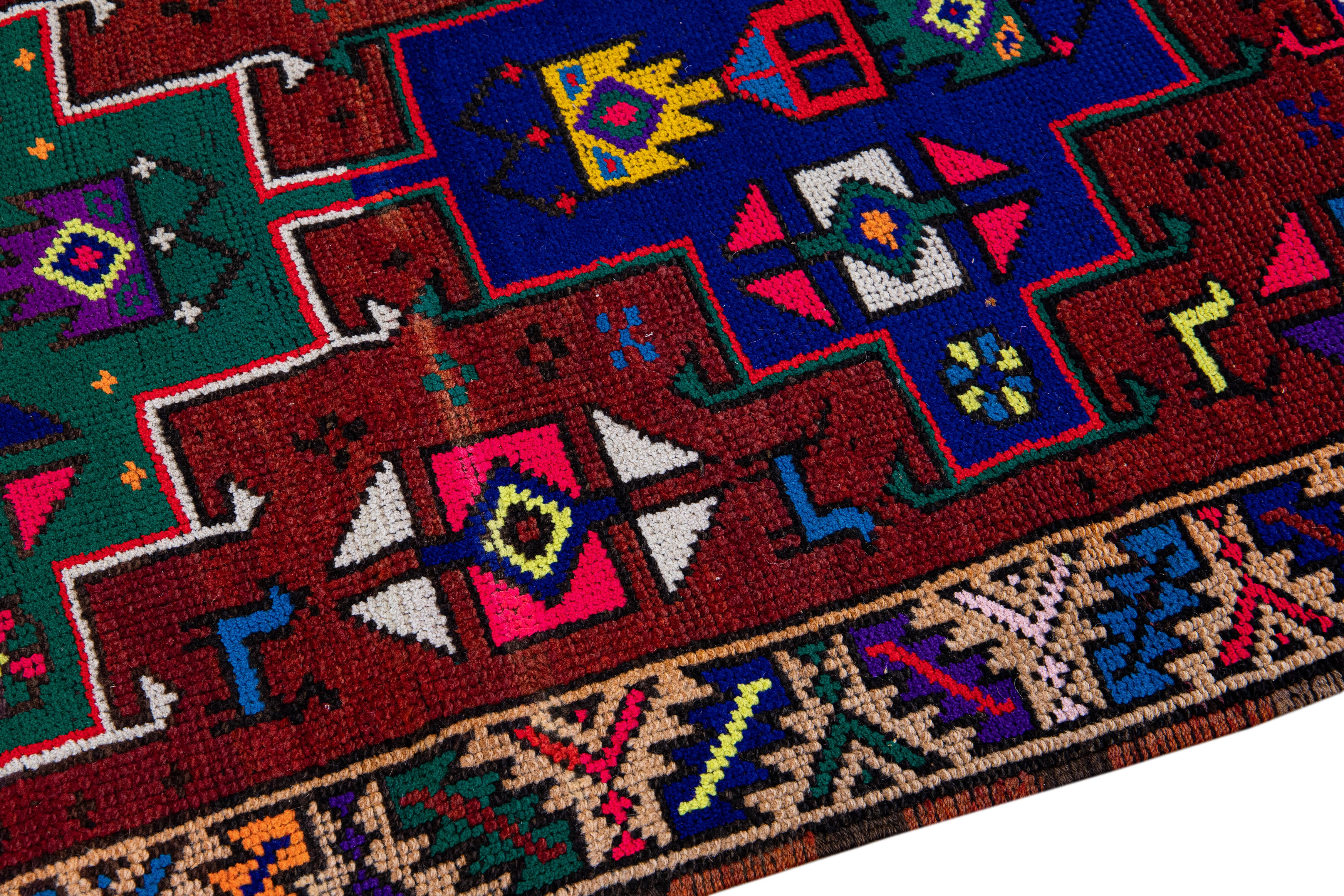 20th Century Vintage Turkish Handmade Multicolor Tribal Pattern Burgundy Wool Runner For Sale