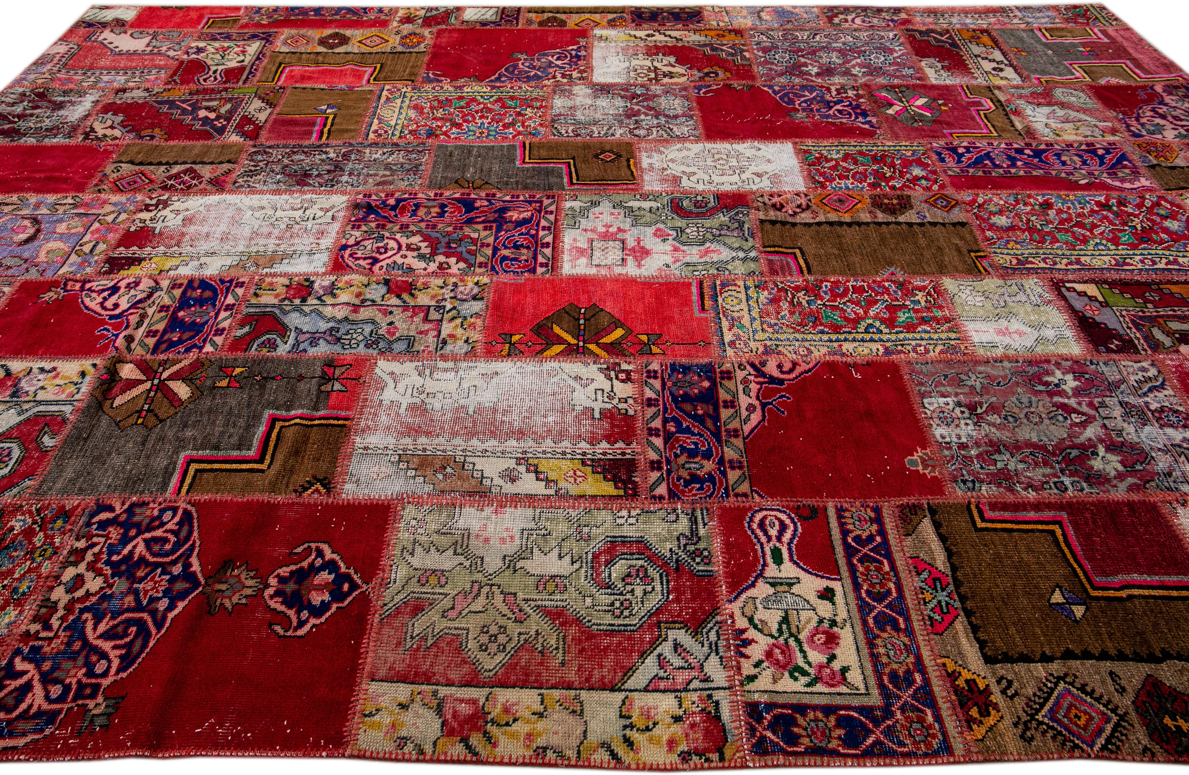 Beautiful vintage Turkish rug with a red field. This rug has a tribal-designed frame with multicolor accents in a gorgeous patchwork design. 

This rug measures 10' x 13'6