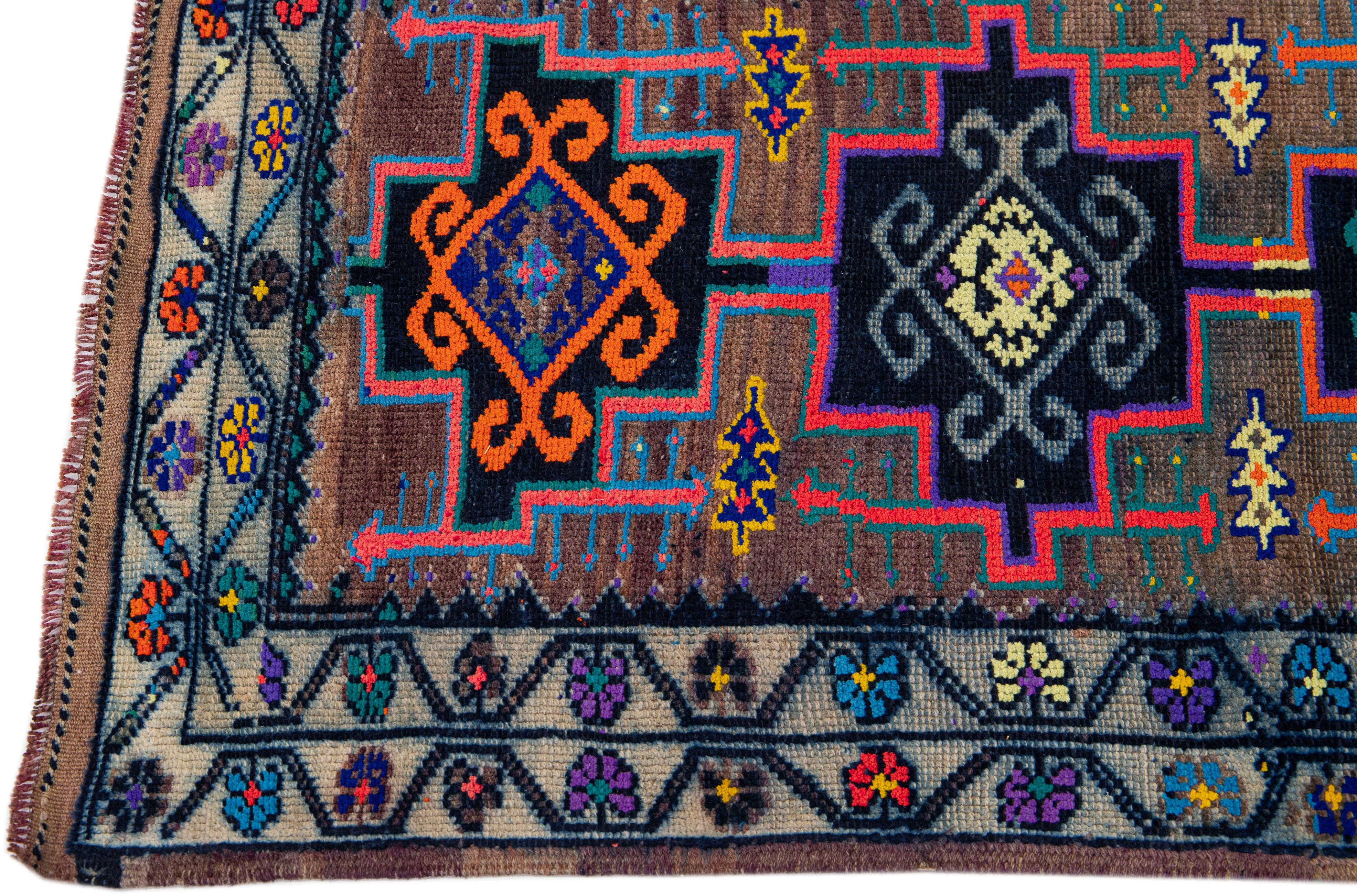 Hand-Knotted Vintage Turkish Handmade Wool Runner with Multicolor Tribal Motif For Sale