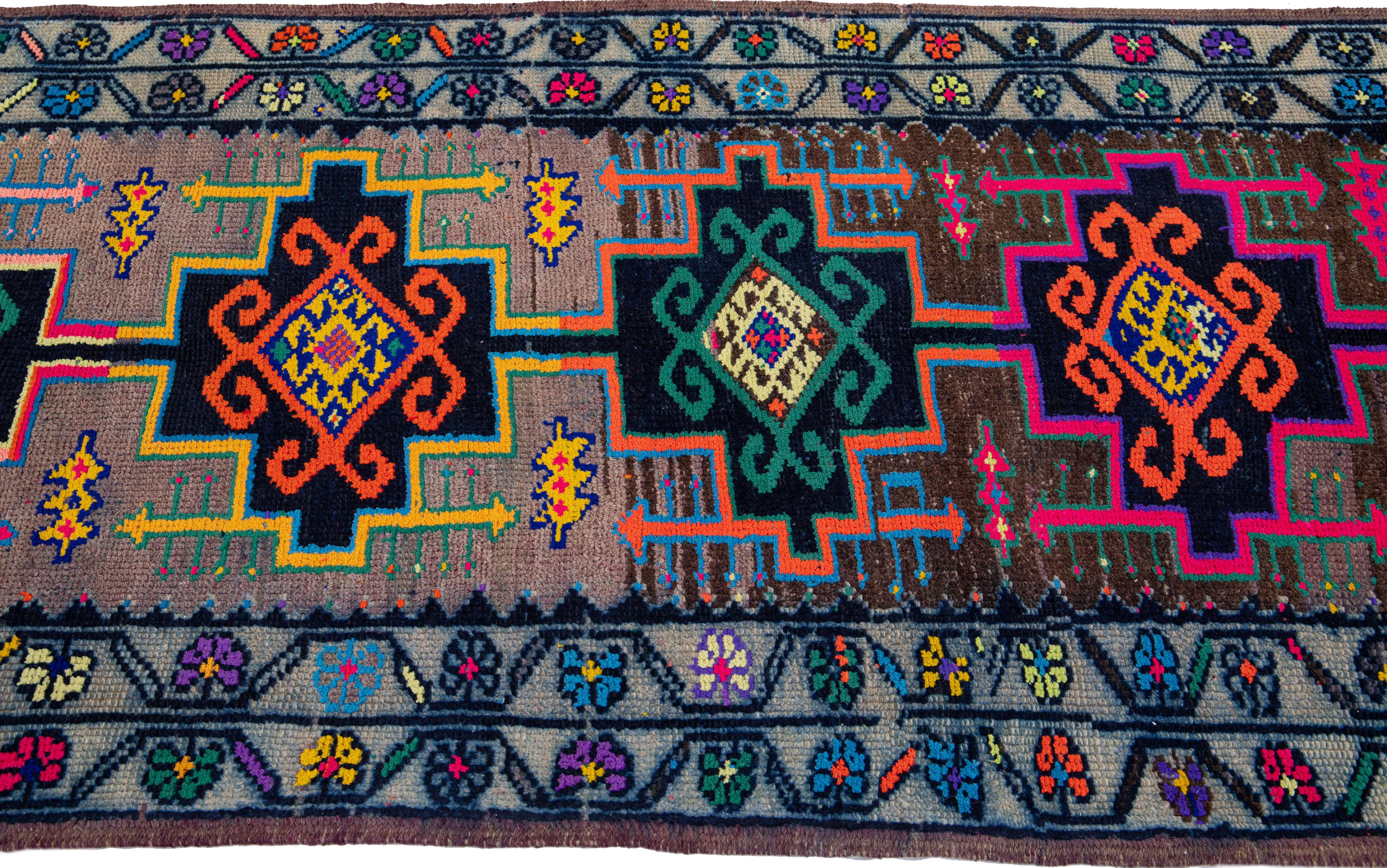 20th Century Vintage Turkish Handmade Wool Runner with Multicolor Tribal Motif For Sale