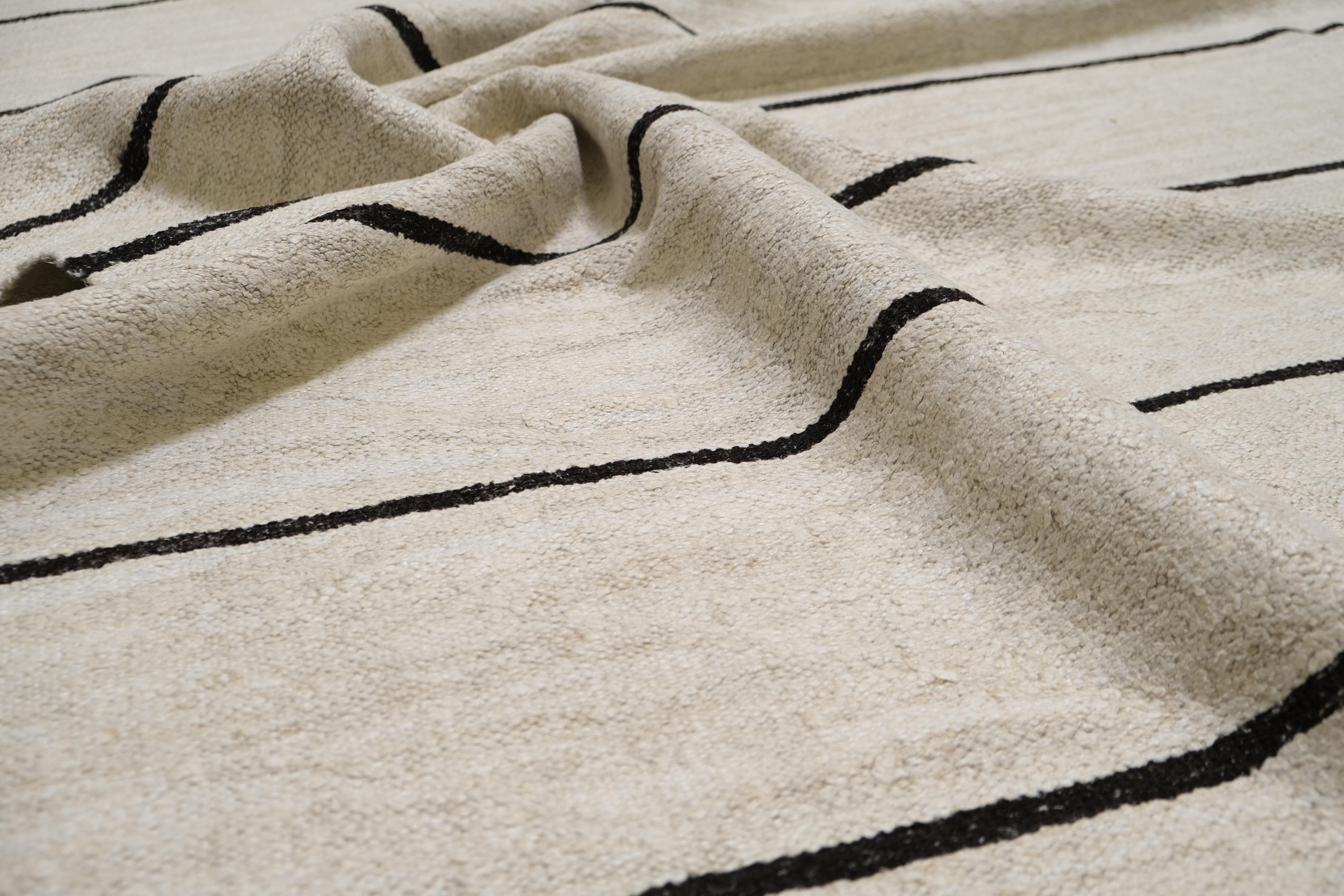 This exquisite handwoven Turkish Hemp Kilim combines timeless craftsmanship with sustainable design, offering a versatile and eco-friendly addition to any living space. Crafted from natural hemp fibers, this kilim showcases the artistry of