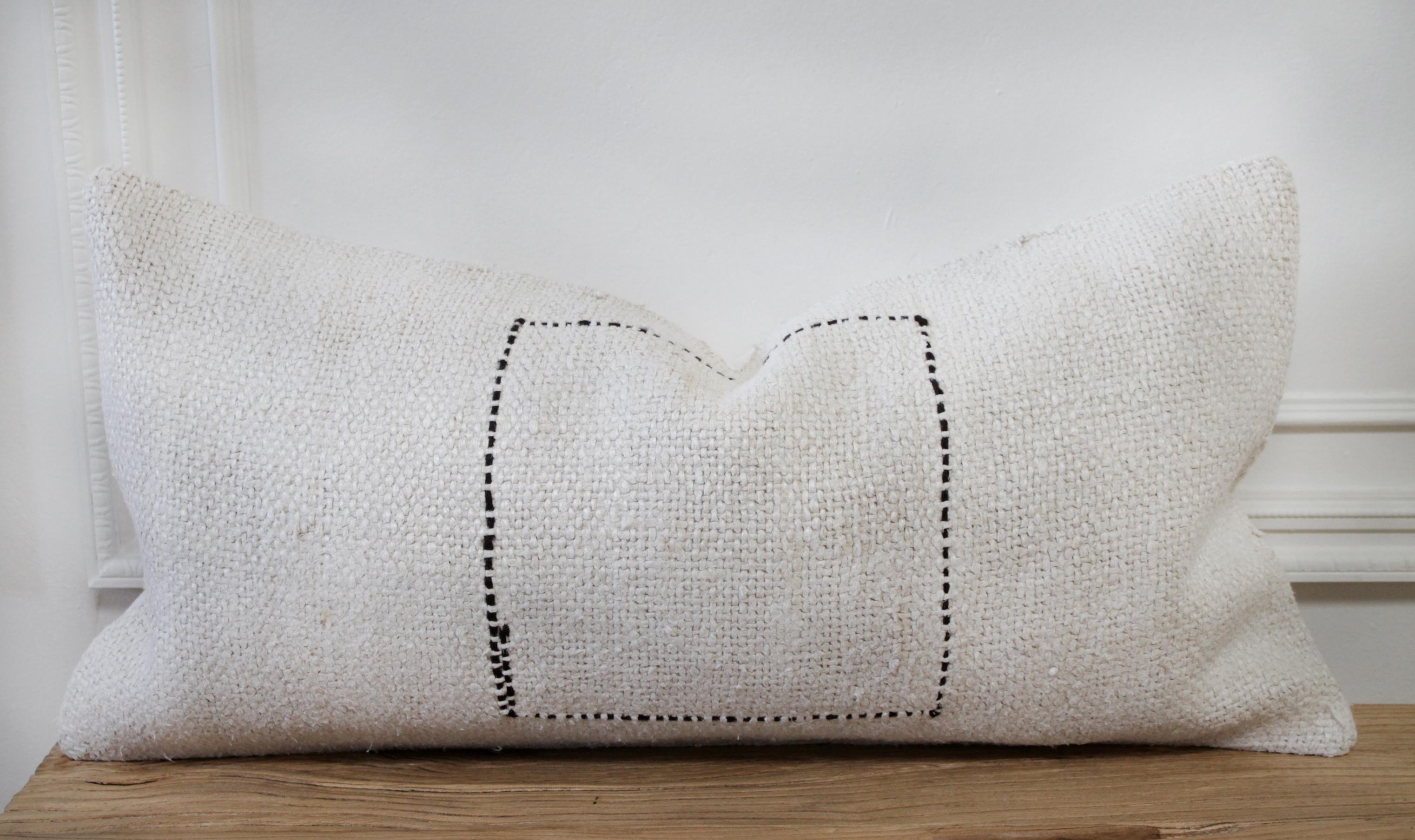 Vintage Turkish Hemp rug pillow in off-white with stitched pattern on face of the pillow. This is a beautiful original hemp rug, in a white to off white color with goat hair textured minimalist square pattern. The backside is a coordinating fabric