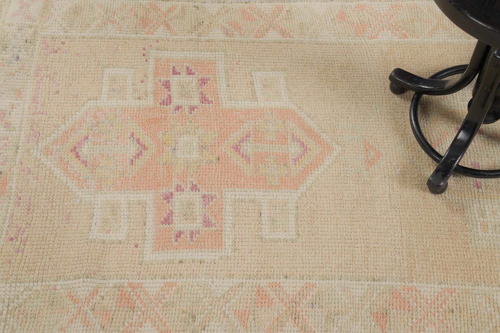 A captivating Vintage Turkish Hereke rug that is a masterpiece of beguiling charm. Stunning embellishments in warm tones of cinnamon are blending seamlessly in the textured field that gracefully complemented in time. This timeless rug emanates