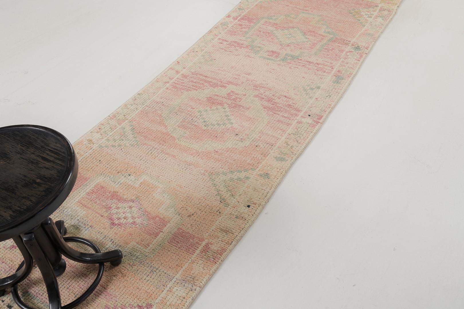Emanating a vibrant character, this beguiling Vintage Turkish Hereke rug provides a captivating design and visually appealing colour scheme. It features symbollical elements that are laced with deep meaning along the abrashed textured field. With