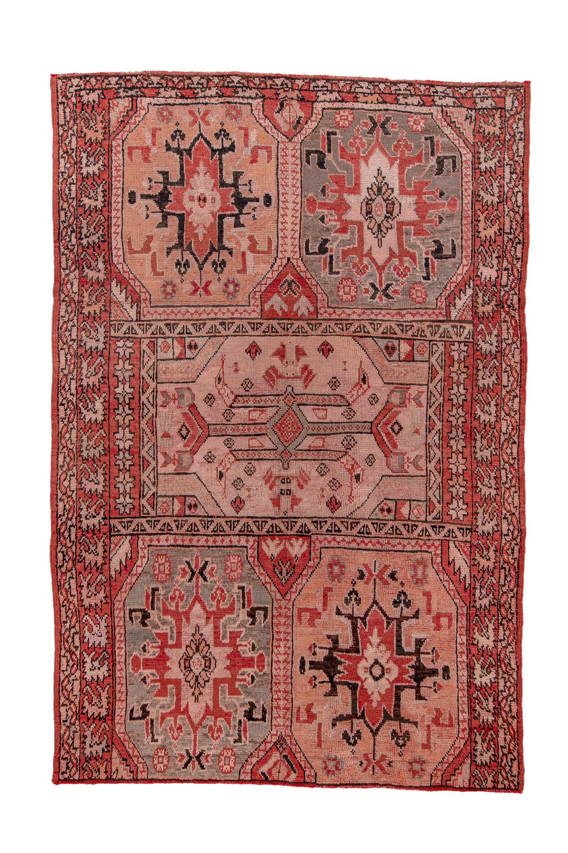  Turkish influence from the “Transylvanian” 17th century rugs is evident in the octagonal panels in straw, cream and various browns, in a 2/1/2 layout. The main red border displays floating leaves in the Anatolian Bergama style. End borders