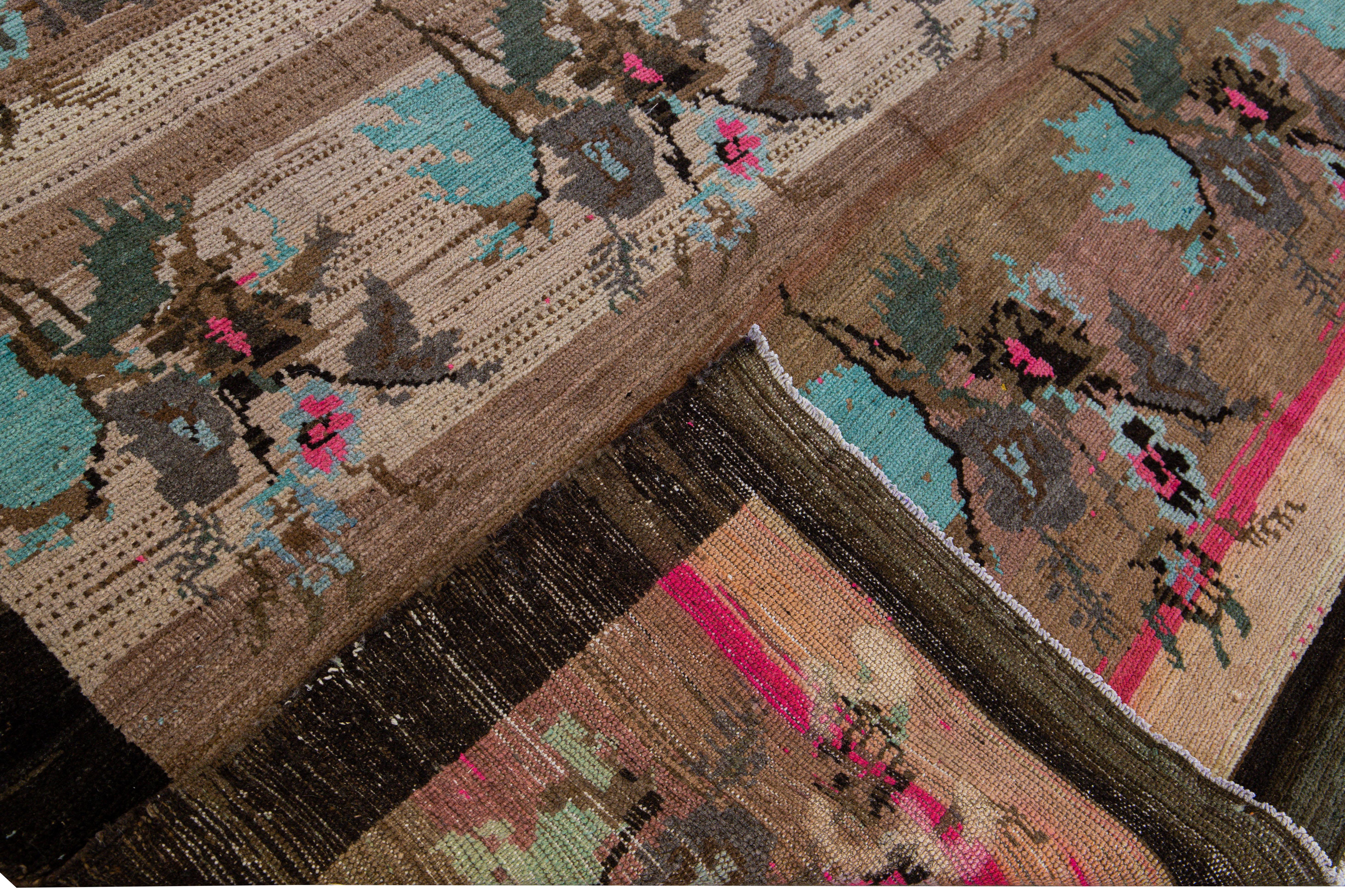 Beautiful vintage Turkish Kars hand-knotted wool rug with a Peach gradient field. This Turkish rug has blue, pink, brown, and gray accents in a gorgeous floral pattern design.

This rug measures: 7'10