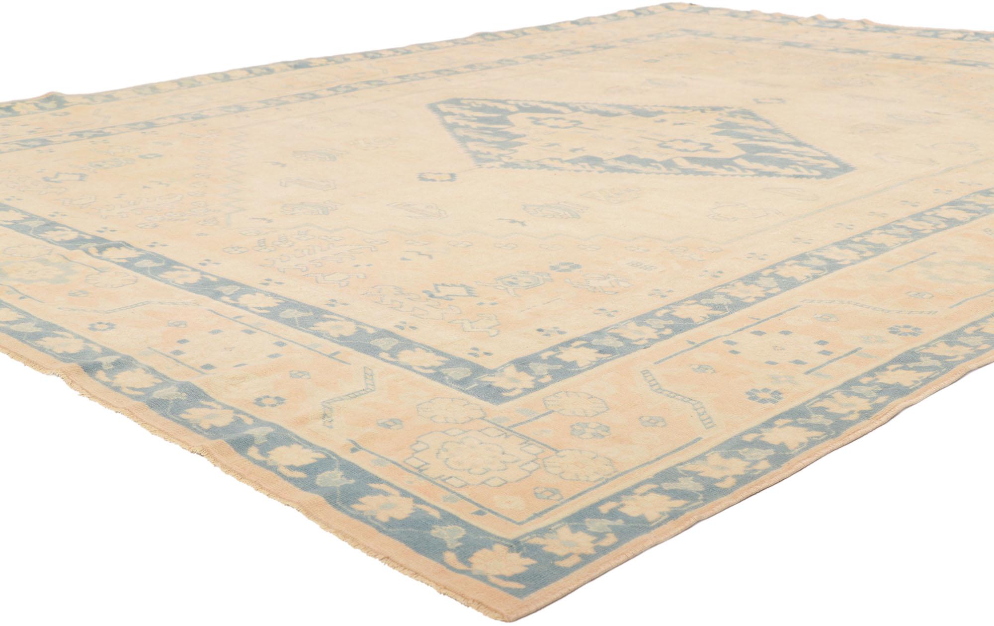 53709 Vintage Turkish Oushak Rug, 07'01 x 09'03.
Soft boho chic meets sophisticated serenity in this hand knotted wool vintage Turkish Oushak rug. The subdued ornamentation and pastel earth-tone colors woven into this piece work together creating a