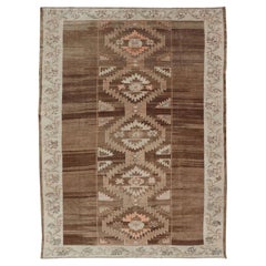 Vintage Turkish Kars Rug in Brown Background with Unique Row of Medallions