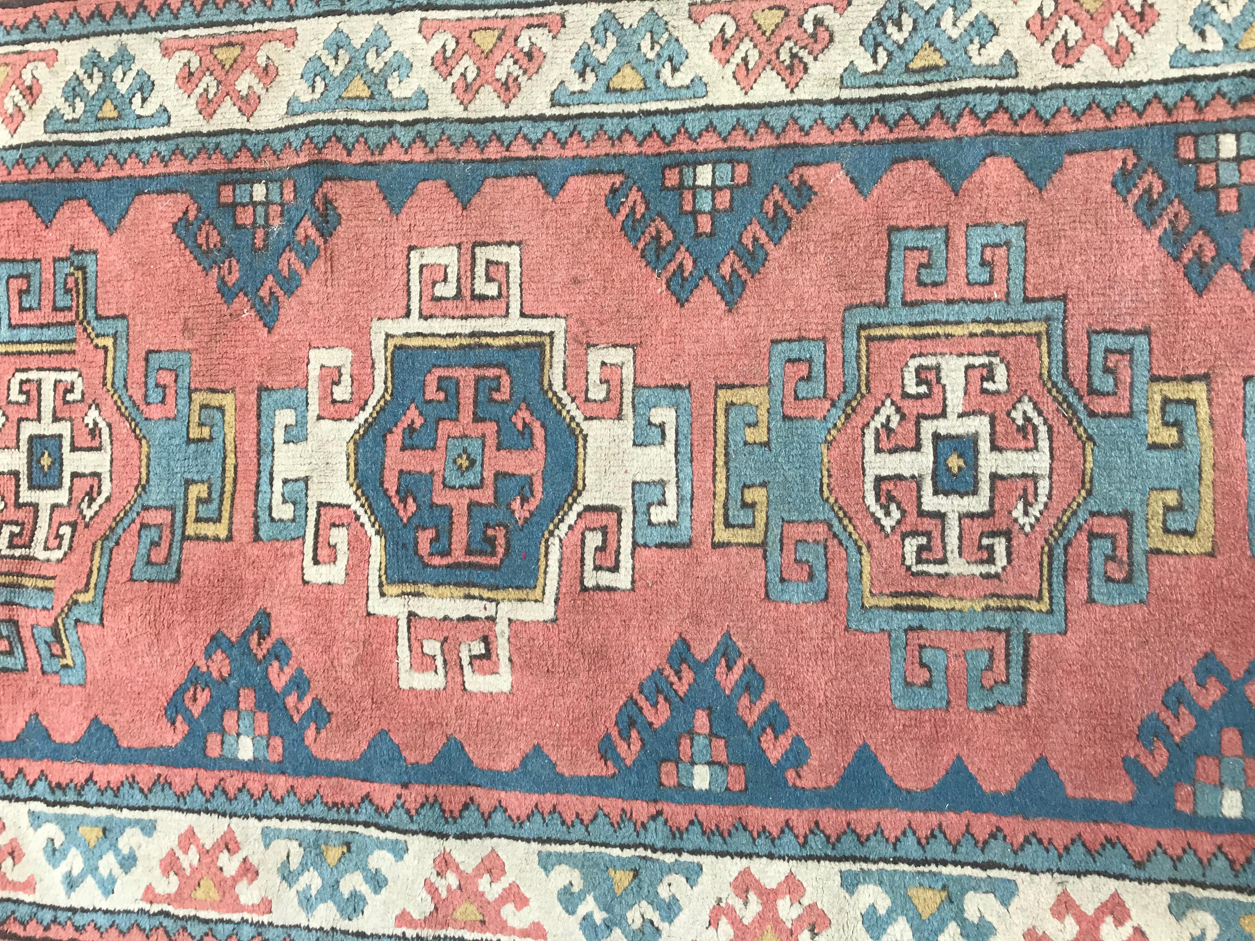 A geometrical design Turkish Kars runner. With a Caucasian design, and beautiful colors with pink, yellow and blue, entirely hand knotted with wool velvet on wool foundation.
  