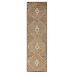 Vintage Turkish Kars Runner in Earth Tones, Light Brown
Geometric Medallions Vintage Turkish Kars Runner in Earth Tones, Light Brown
Geometric Medallions
