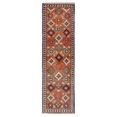 Vintage Turkish Kars Runner with Tribal Motif Design in Orange-Brown Colors