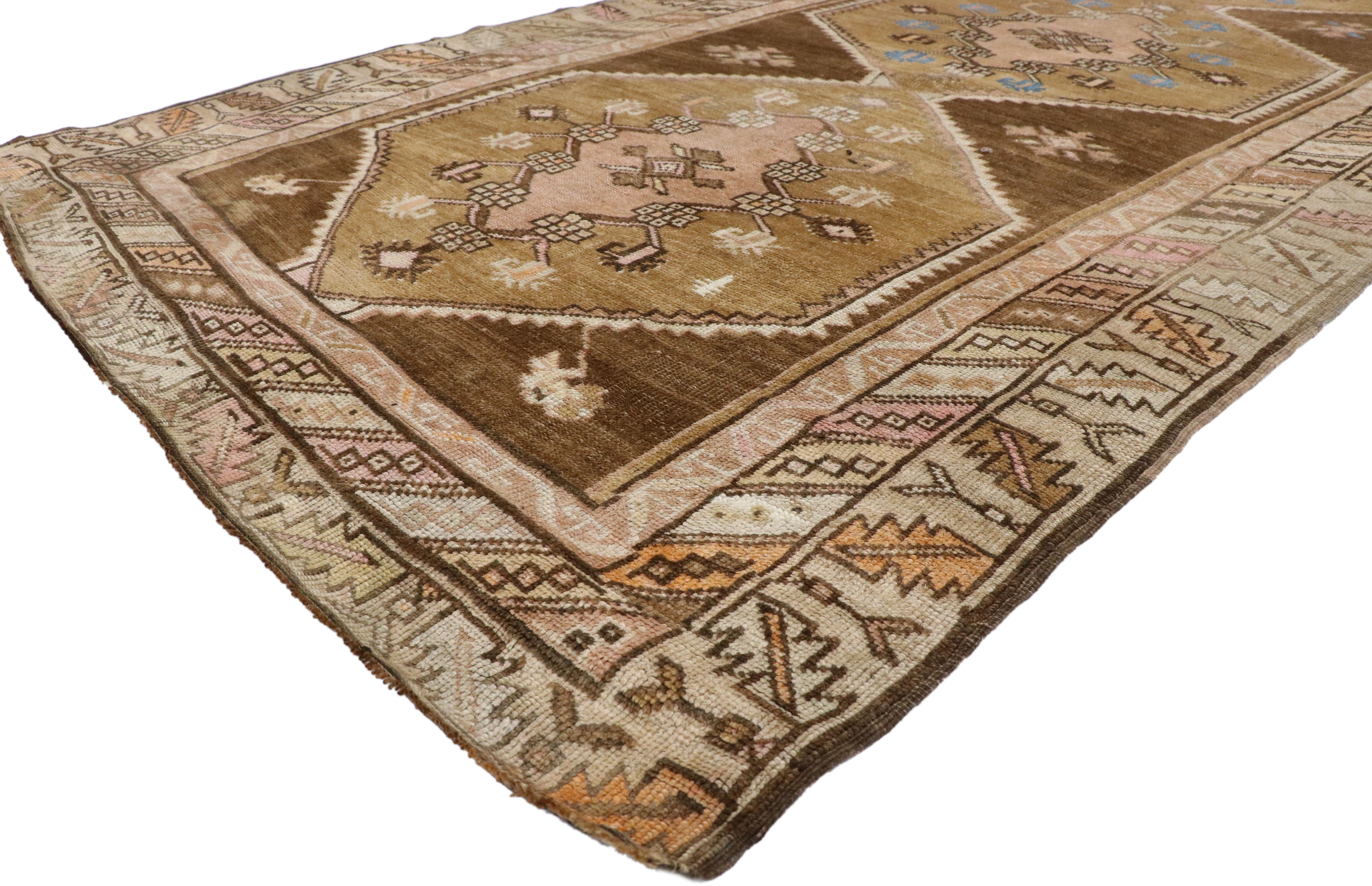 52179 Vintage Turkish Oushak Runner with Romantic Prairie Style, Kars Gallery Rug 04'04 x 11'07.  Warm earth-tones with pastel hues combined with  floral elements of the Prairie School Movement collide in this hand knotted wool vintage Turkish Kars