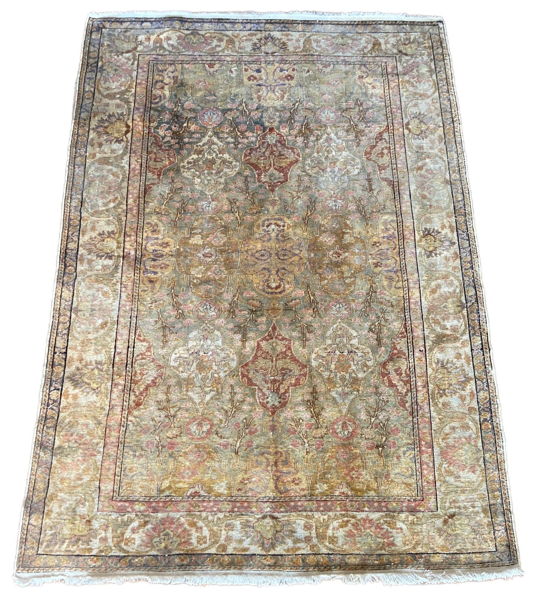 A fabulous vintage silk rug, hand woven in Kayseri, central Turkey circa 1960 with an allover shield design in soft pastel tones. Very finely woven in silk on a cotton foundation.
Size: 1.65m x 1.16m (5ft 5in x 3ft 10in)
This rug is in good