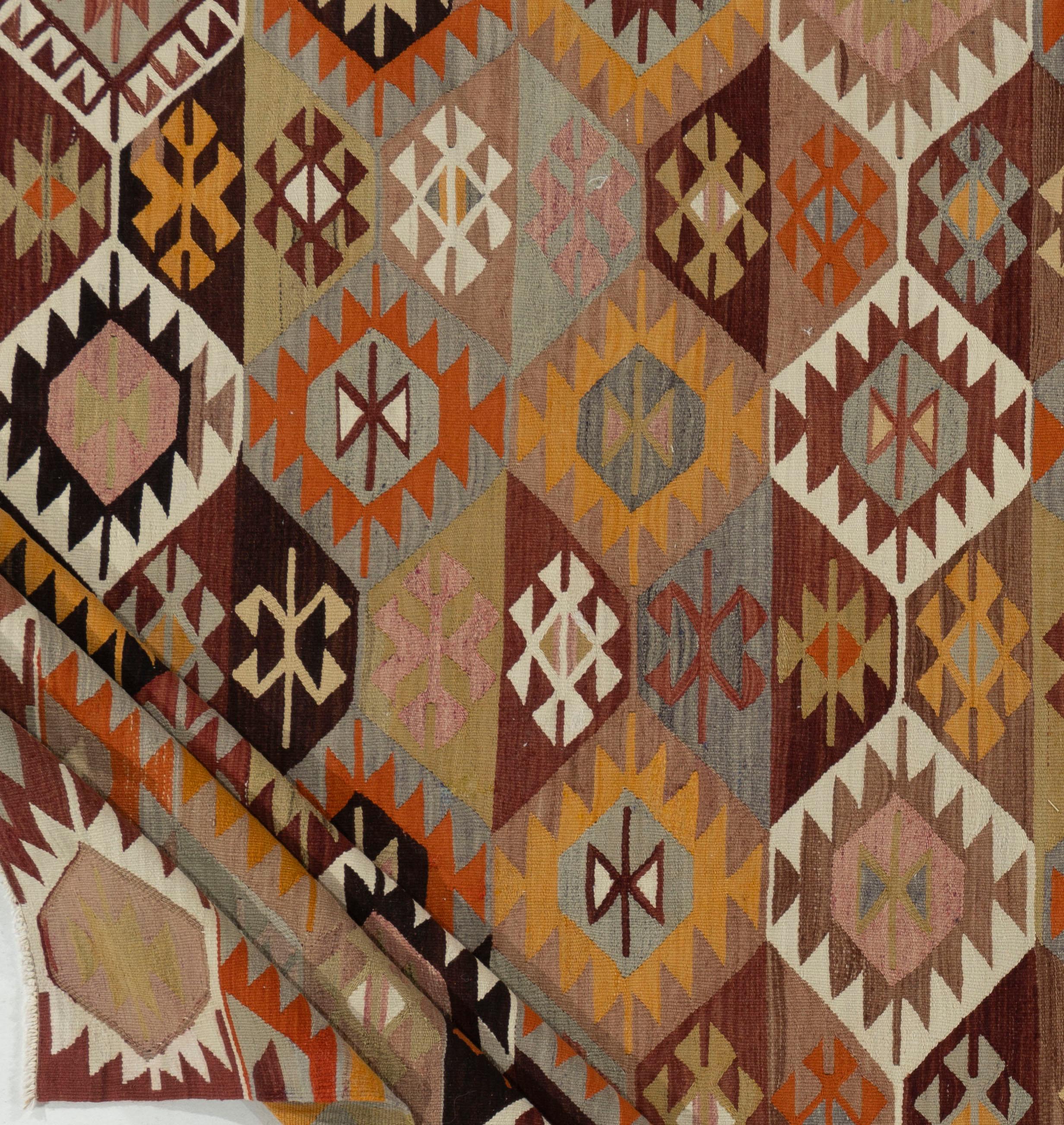 Vintage Turkish Kilim 5'4 X 9'4. This vintage Turkish flat weave Kilim is hand-woven. The simplicity and boldness of this piece can also give a contemporary feel and is able to look at home in both a modern and traditional setting. The geometric