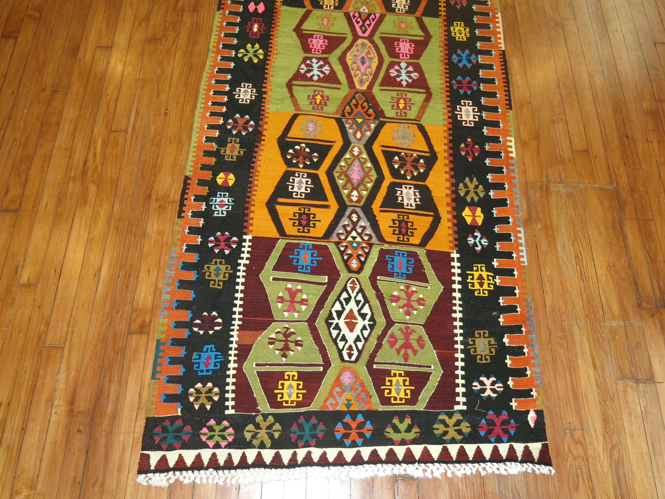 Wide and long colorful Turkish geometric Kilim flat-weave runner.

3'6'' x 14'7''