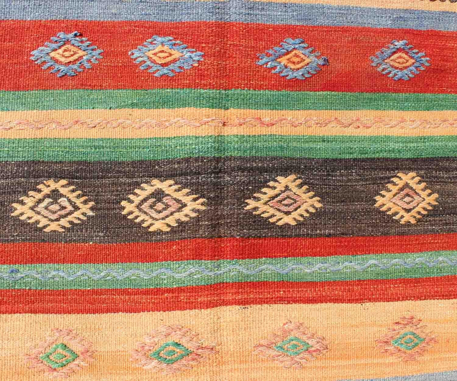 Wool Vintage Turkish Kilim Carpet with Colorful Geometric Stripe Design For Sale