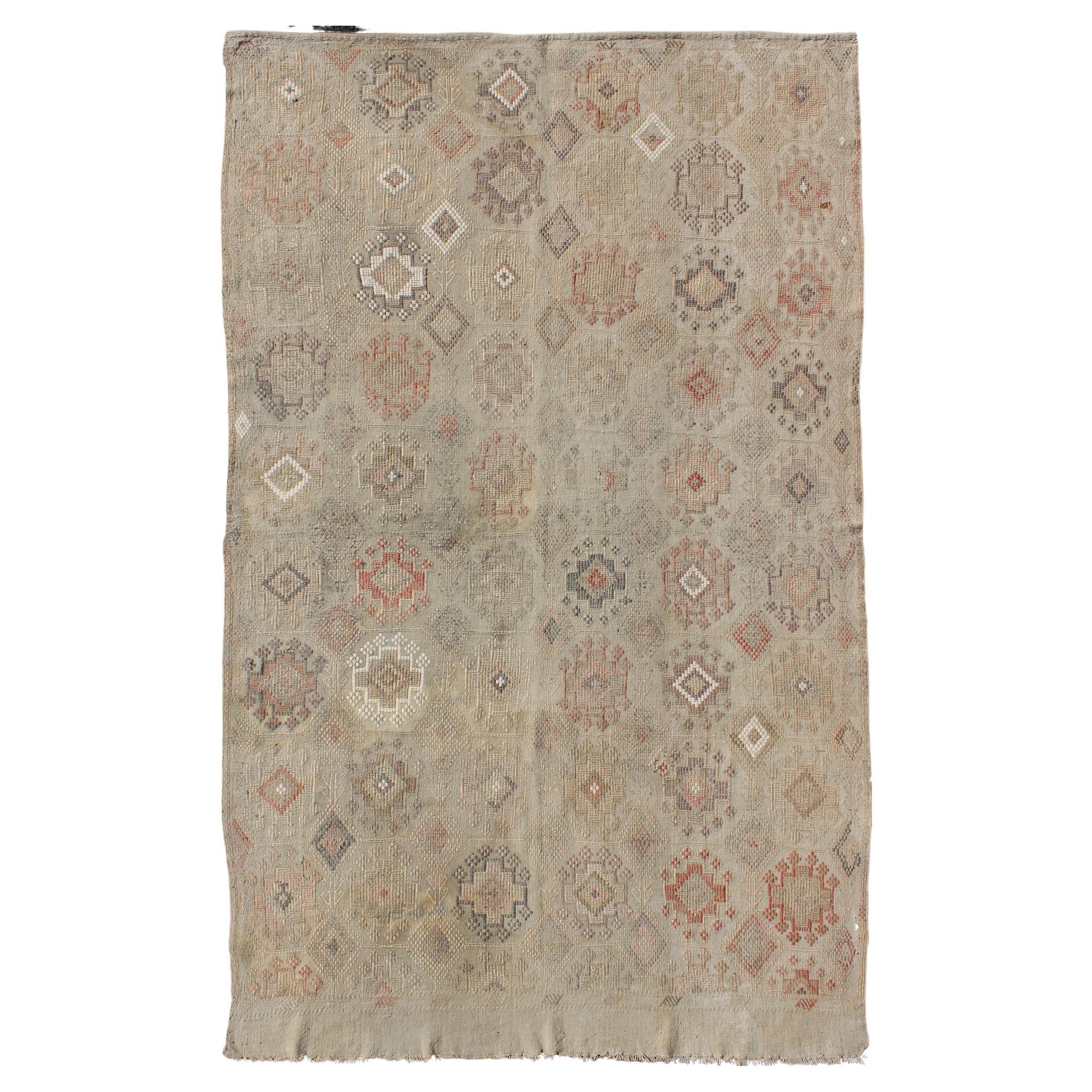 Vintage Turkish Kilim Featuring Muted Colors and All-Over Tribal Motif Design