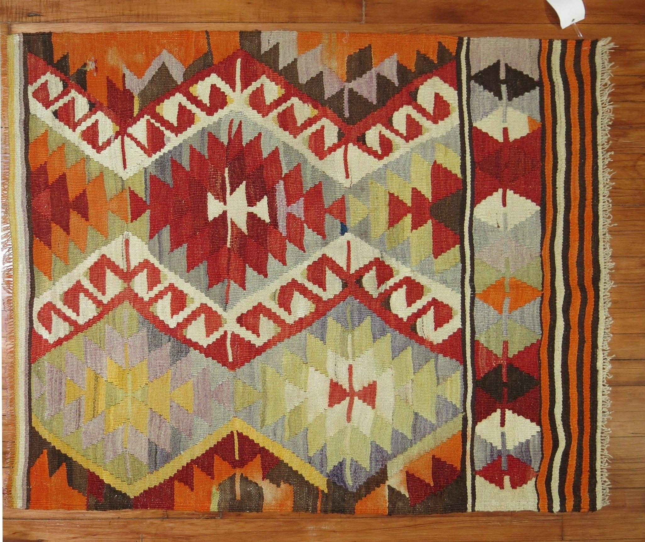 A vintage Turkish Kilim scatter rug from the mid-20th century.
