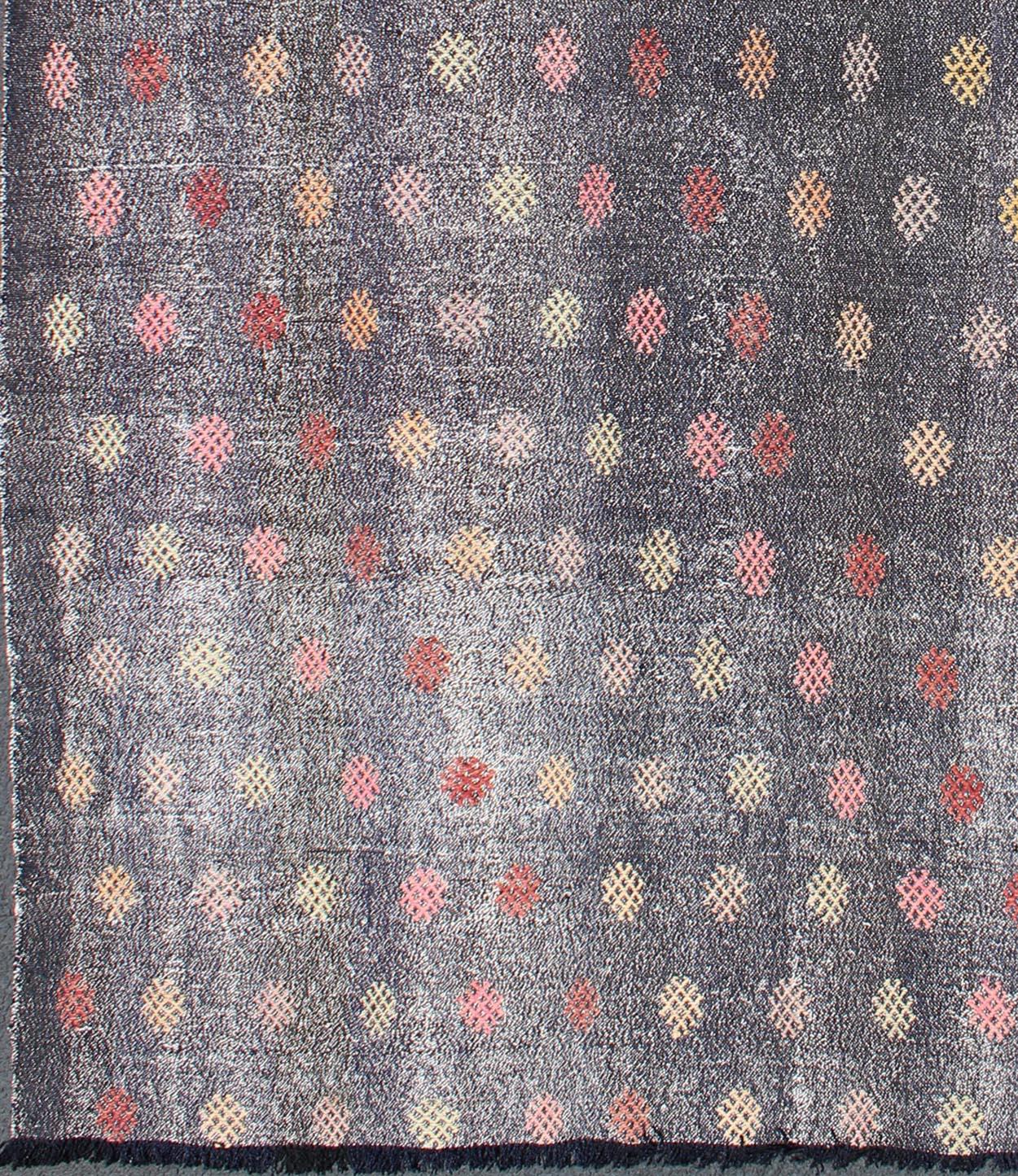 This marvelous geometric kilim with embroidered flowers showcases a modern, all-over repeating pattern, paired with a distinct set of random colors such as pink, grey, green, blue, ivory, red, black, cream and yellow.

Measures: 6'6'' x