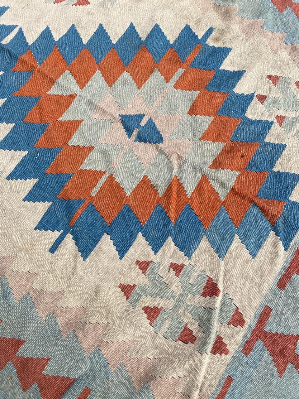Beautiful Kilim from turkey with geometrical design and light colors, entirely hand woven with wool on wool foundation.