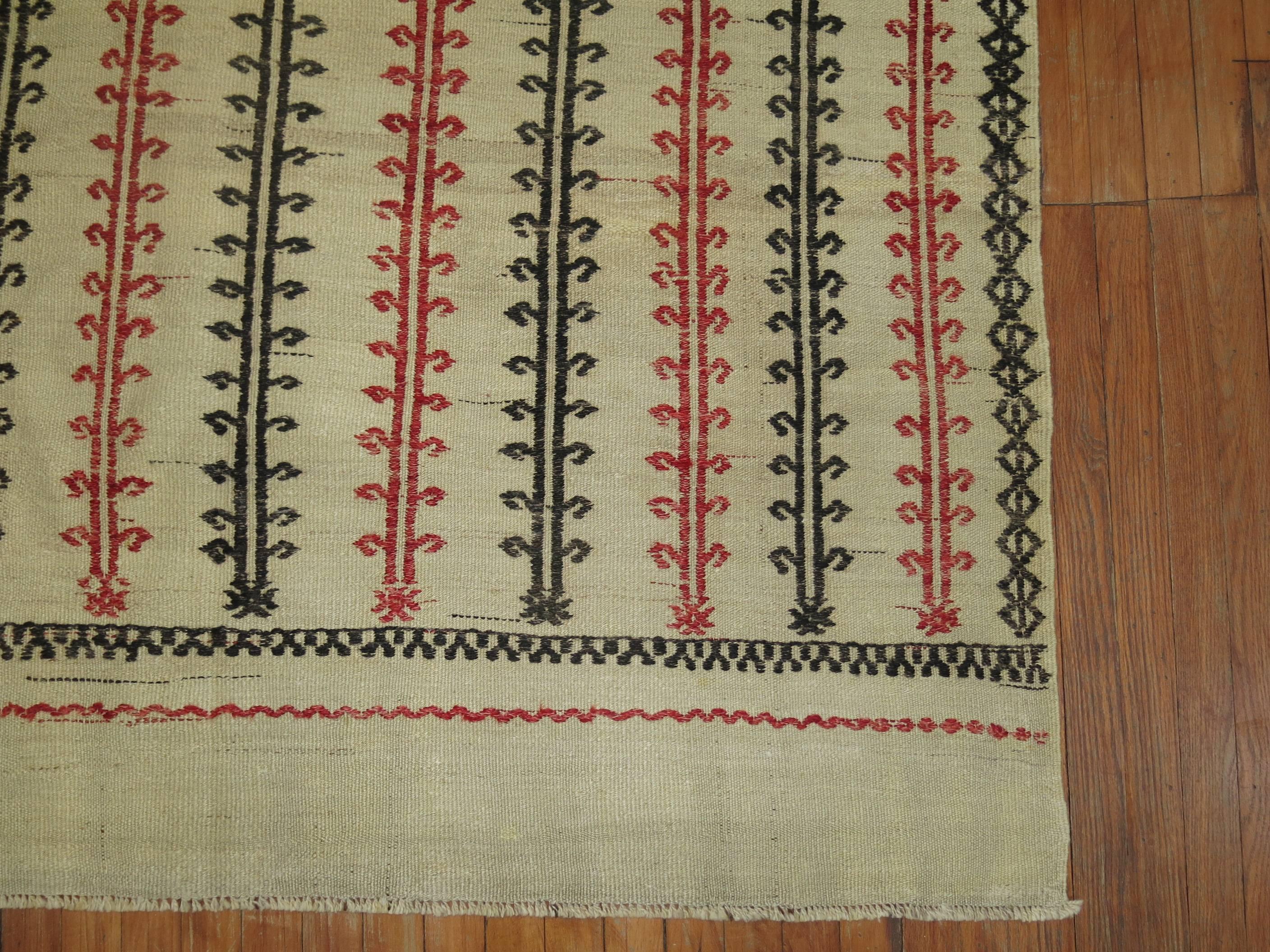 One of a kind vintage Turkish Kilim in shades of white, red and black.