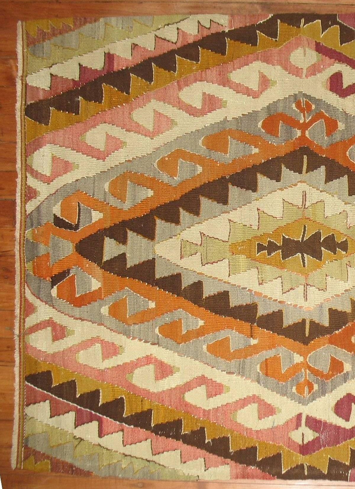 A vintage Turkish Kilim scatter rug from the mid-20th century.