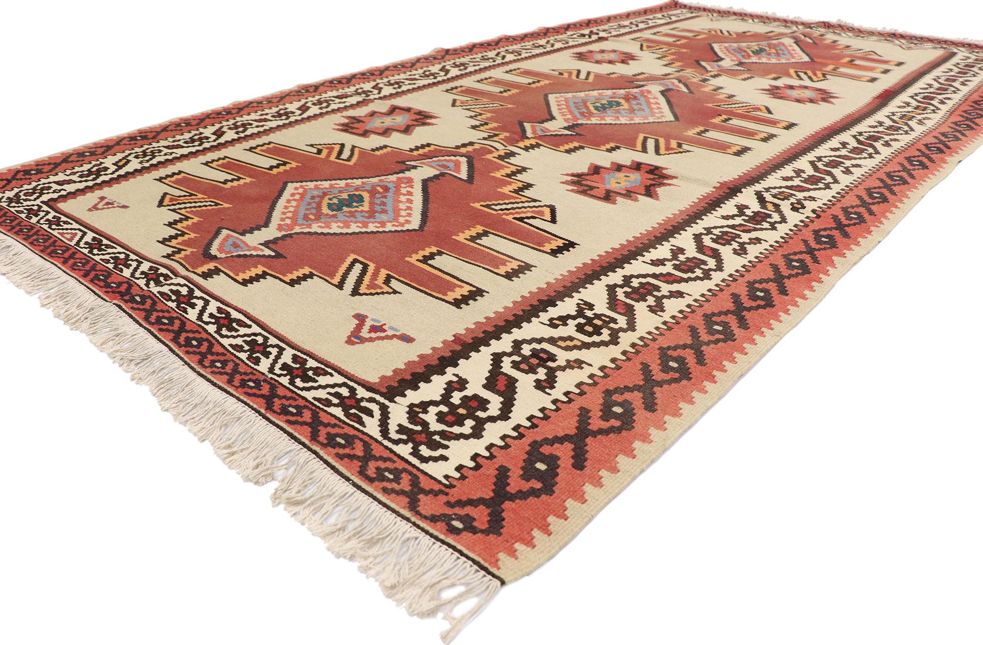 78005 vintage Turkish Kilim rug with Tribal style 05'05 x 09'10. Full of tiny details and a bold expressive design combined with with warm earthy color palette and tribal style, this hand-woven wool vintage Turkish kilim rug is a captivating vision