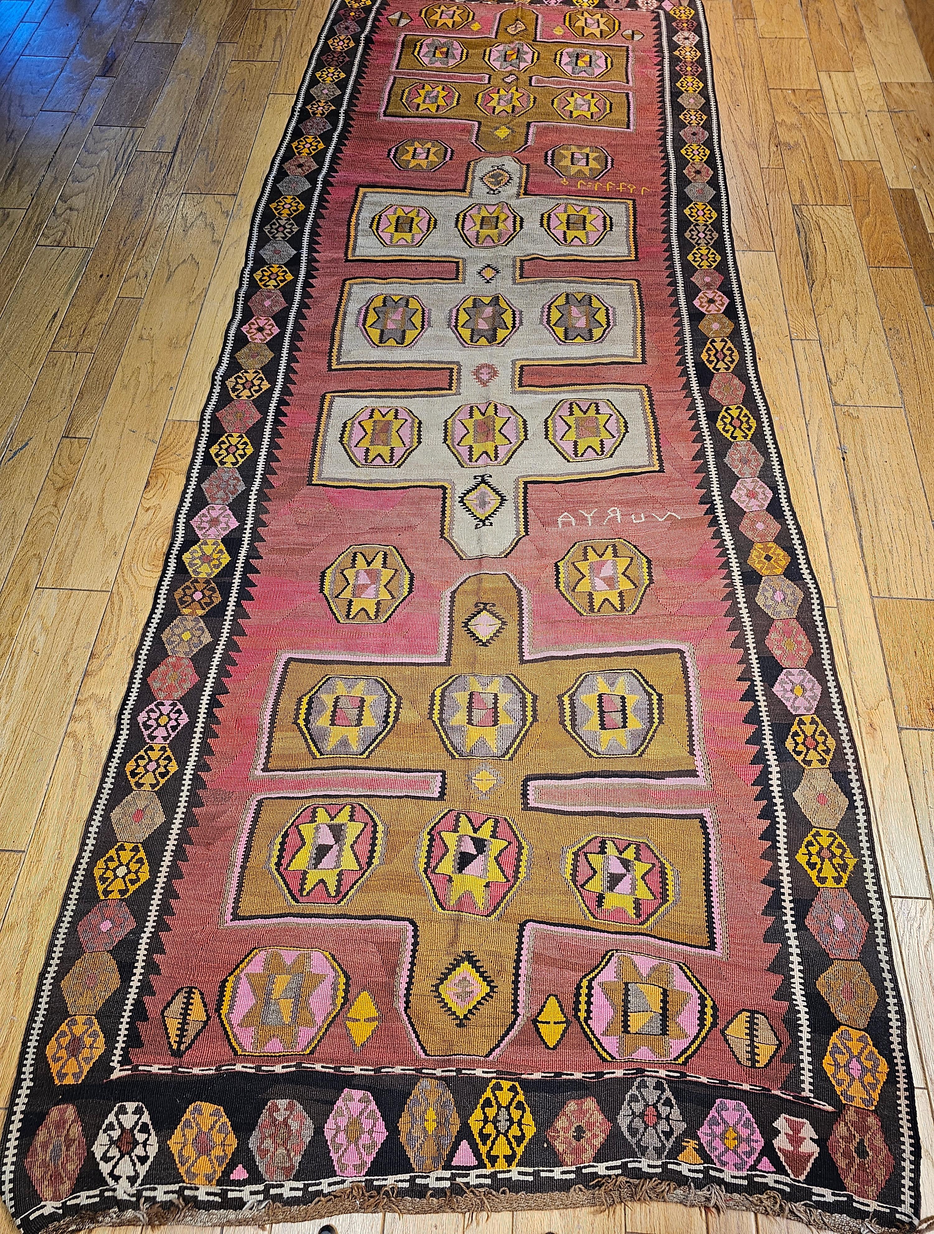 Vintage Turkish Anatolian Kilim from the early 1900s.  This kilim has bright and beautiful colors in large design, making this a unique Kilim from the Eastern Anatolian region by the Armenian weavers in the early part of the 1900s. The script in