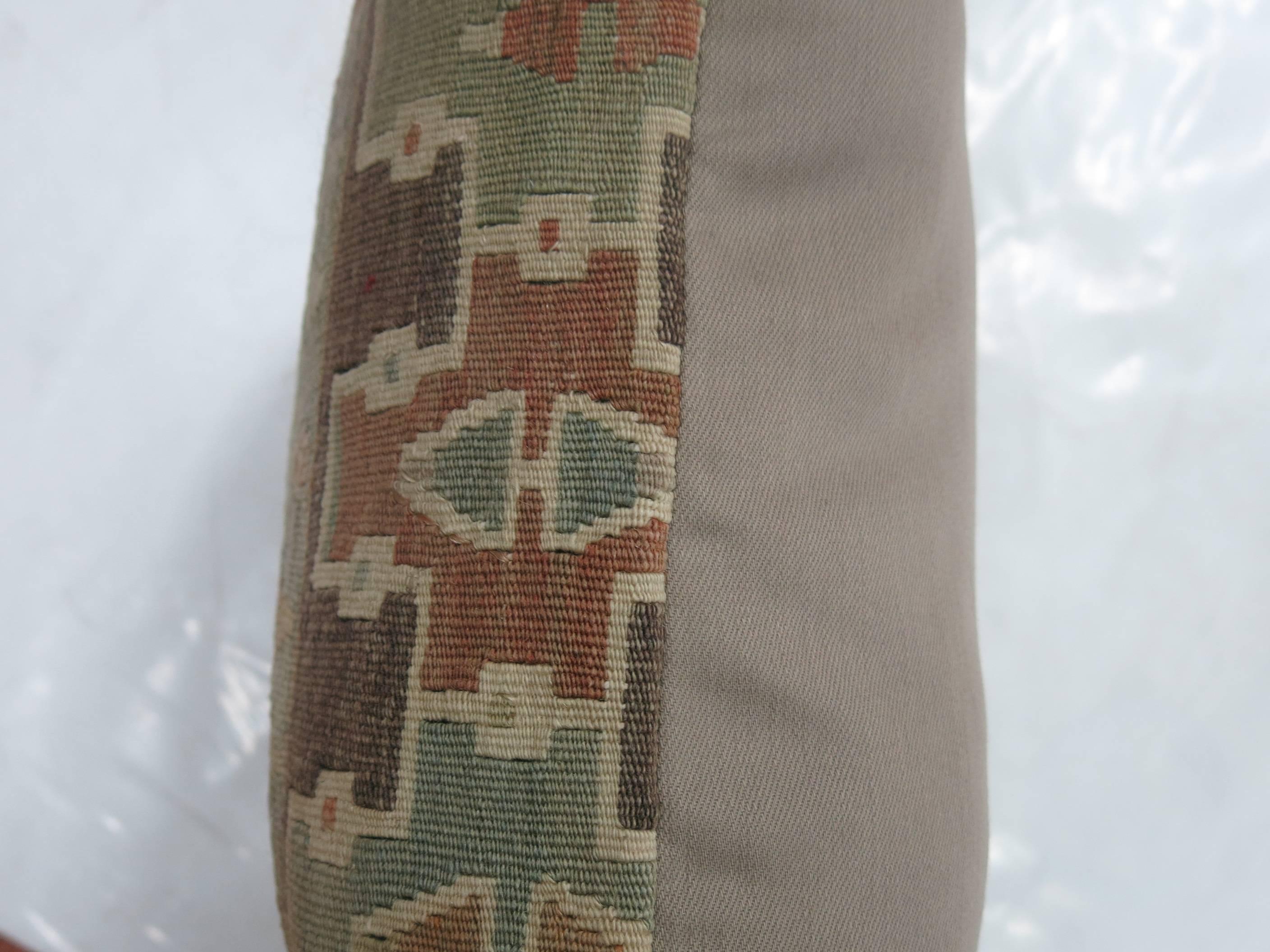 Pillow made from an earth-toned Turkish Kilim.