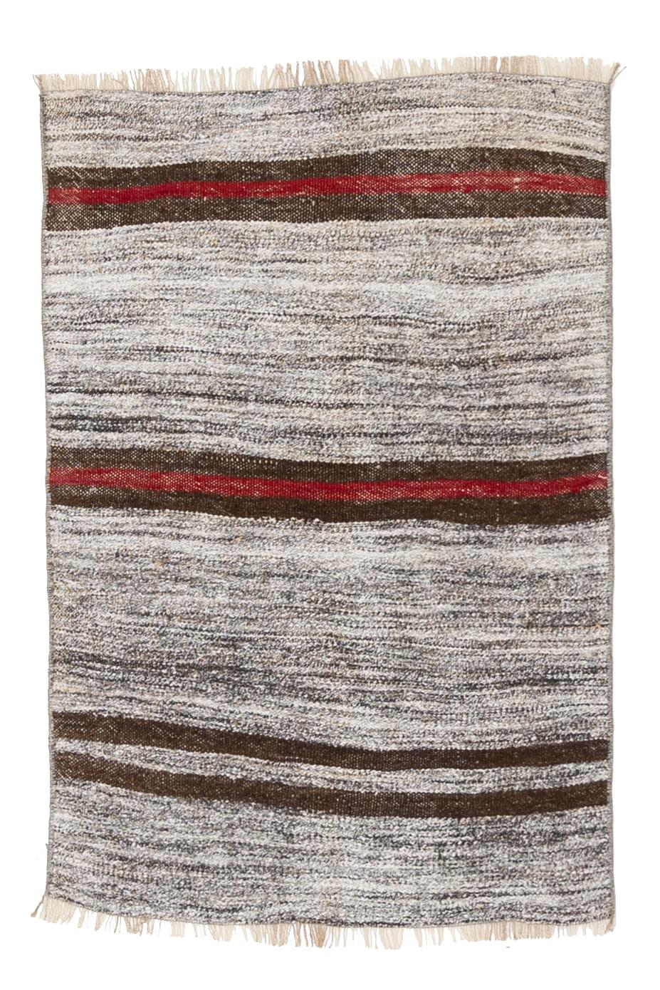 Age: Circa 1950

Colors: Striated grays, chocolate brown, cherry red

Pile: flatwovern

Wear Notes: 1

Material: Goat hair, hemp.

We love the organic feel of the striated grays and wabi-sabi stripes. The perfect way to add a little pop of color to