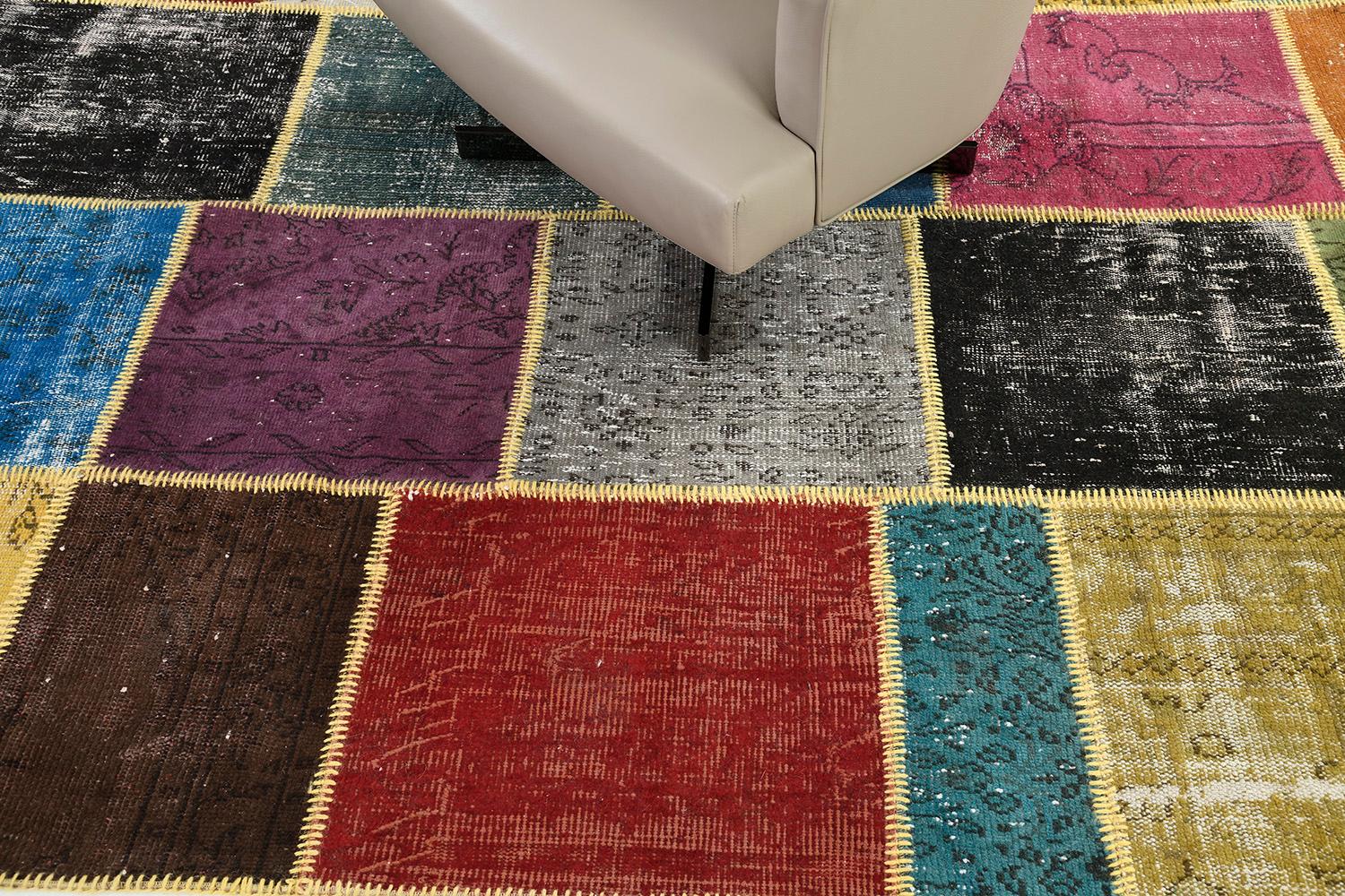 Displaying a charming and captivating appearance, this Vintage Turkish Patchwork kilim is an embodiment of modern rustic preppy style. The patchwork pattern is composed of intricately designed variegated irregular squares and rectangles. With its