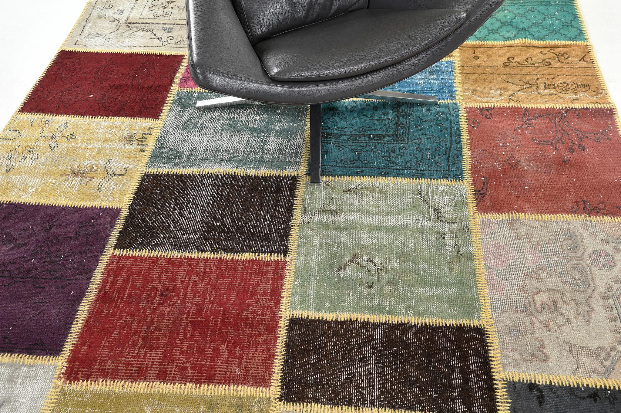 Displaying a charming and captivating appearance, this Vintage Turkish Patchwork kilim is an embodiment of modern rustic preppy style. The patchwork pattern is composed of intricately designed variegated irregular squares and rectangles. With its
