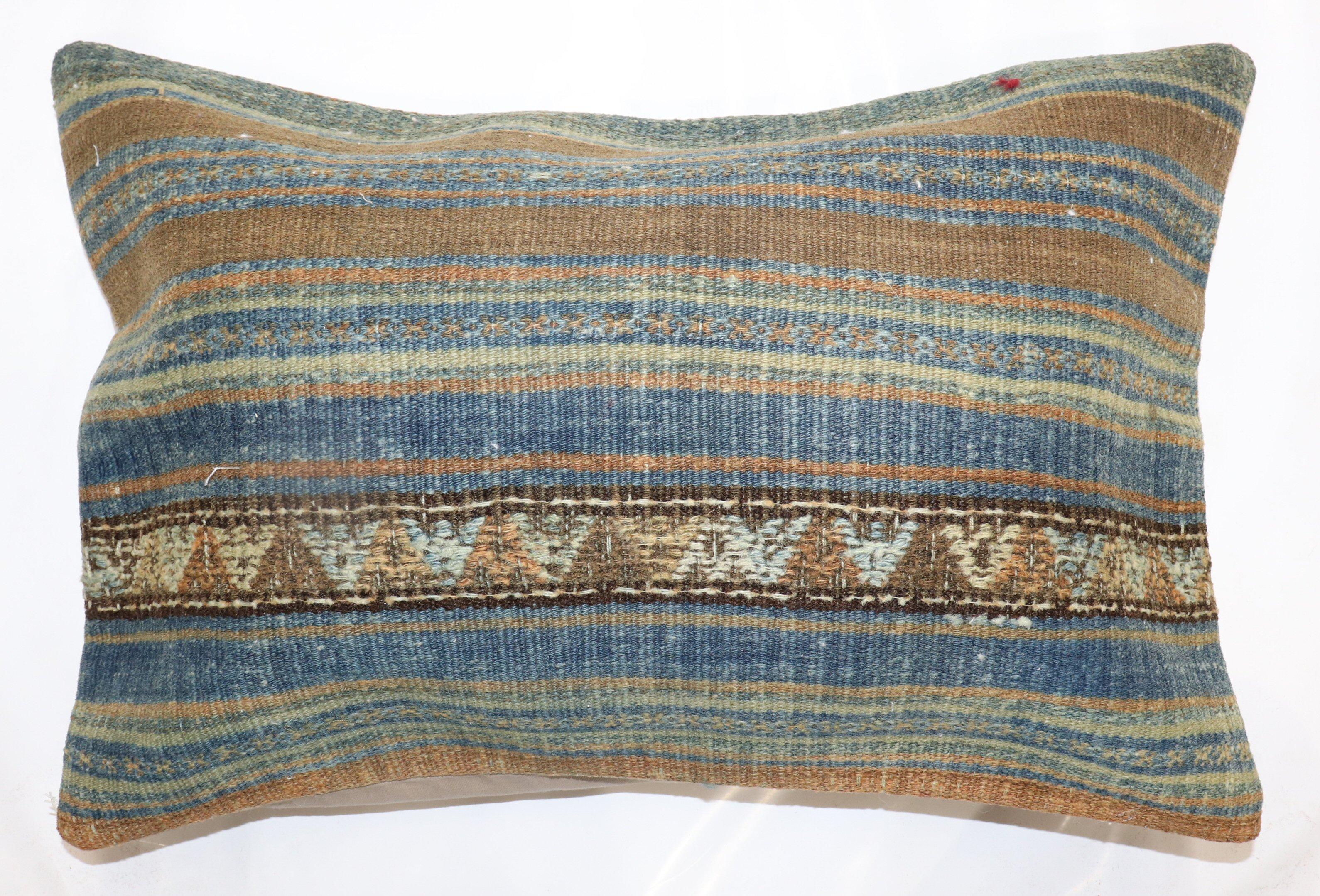 Pillow made from a vintage Turkish Kilim with cotton back. Zipper closure and foam insert provided. 

Measures: 14'' x 22''.