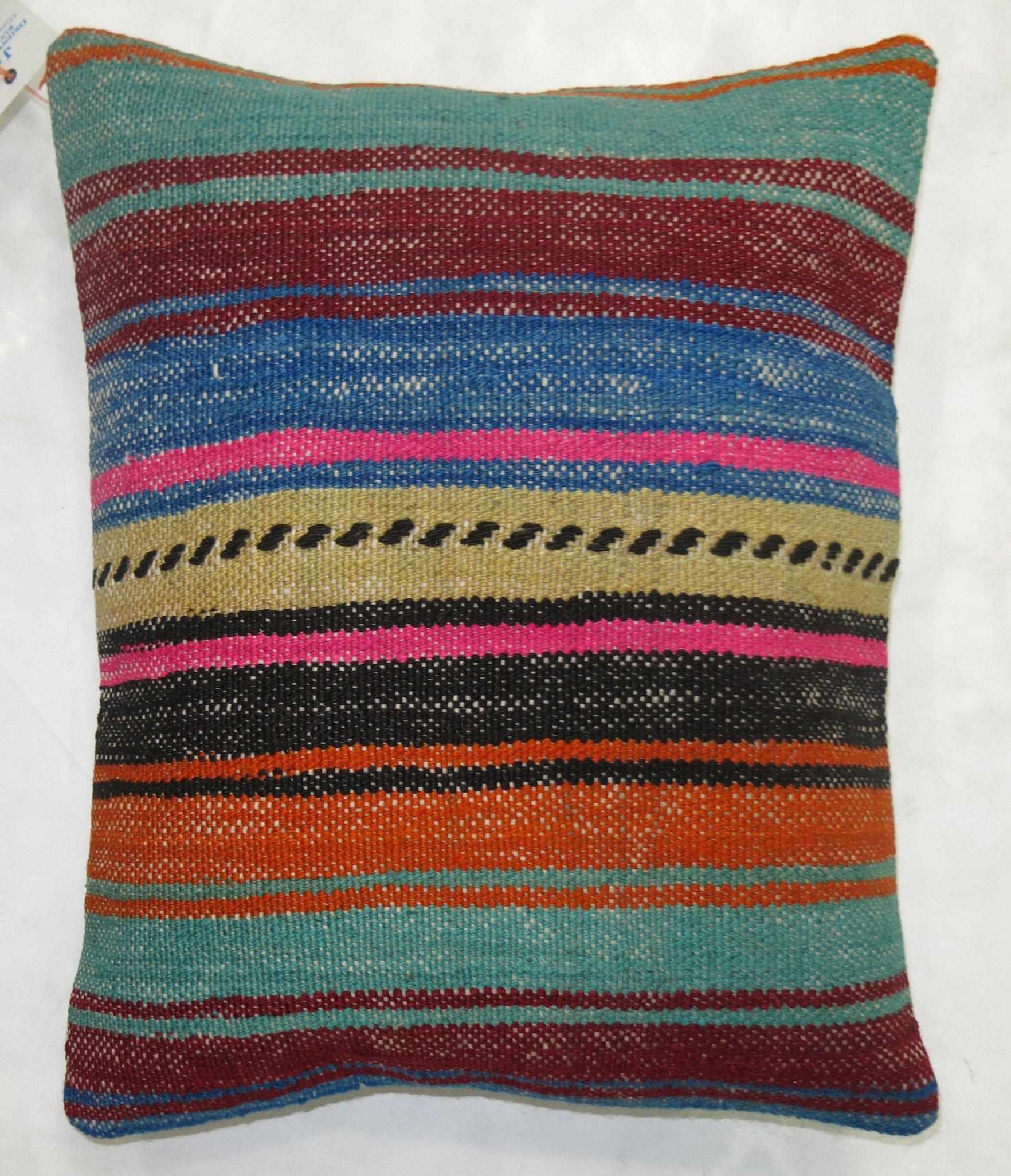 Pillow made from a vintage Turkish Kilim with a cotton back. Zipper closure and foam insert provided. 

Measures: 15'' x 18''.