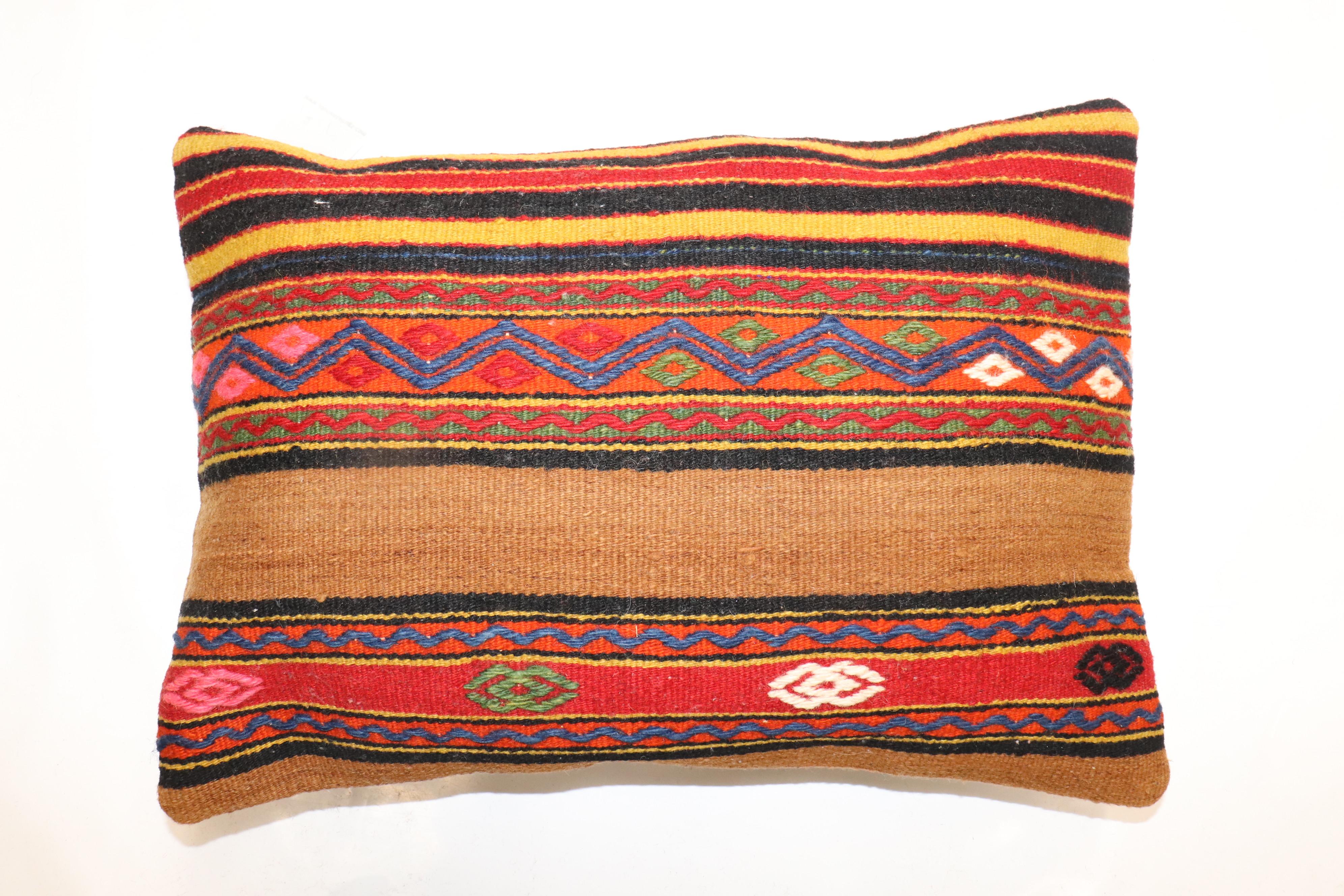 Pillow made from a vintage Turkish Kilim with a cotton back. Zipper closure and foam insert provided. 

Measures: 14'' x 20''.