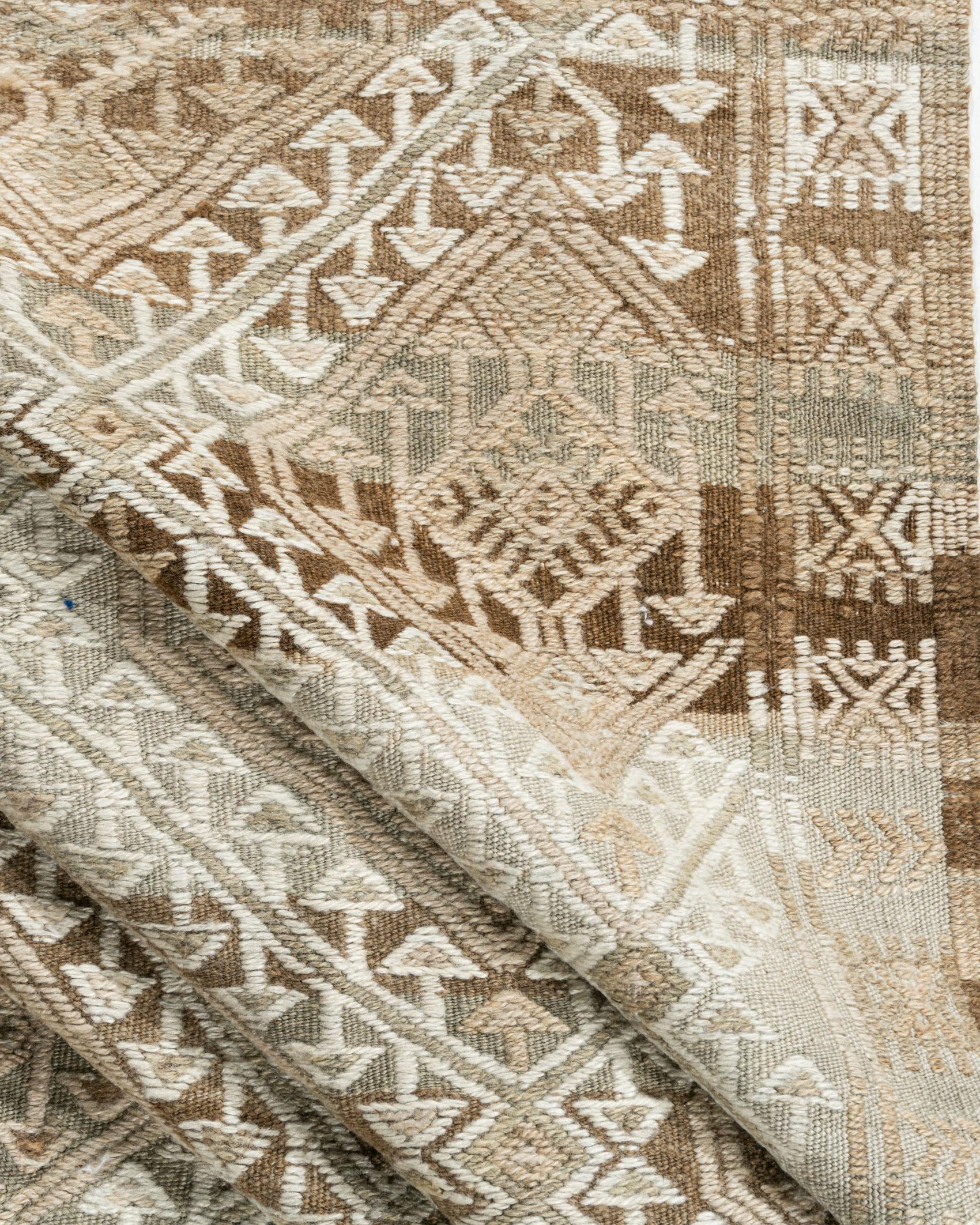 Handwoven in the 1940s, this vintage Turkish flat-weave Kilim exemplifies timeless craftsmanship. Its bold geometry and understated elegance create a striking balance—equally at ease in a modern minimalist interior or a richly layered traditional