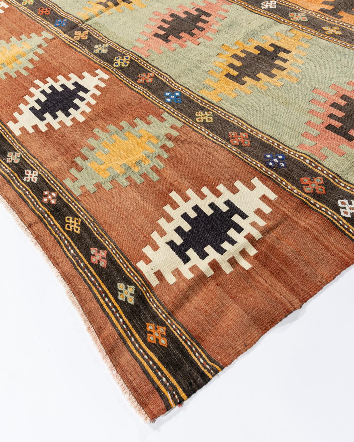 Vintage Turkish Kilim rug 6'10 X 12'7. This vintage Turkish flat weave Kilim was hand-woven in the 1950's. The simplicity and boldness of this piece can also give a contemporary feel and is able to look at home in both a modern or traditional