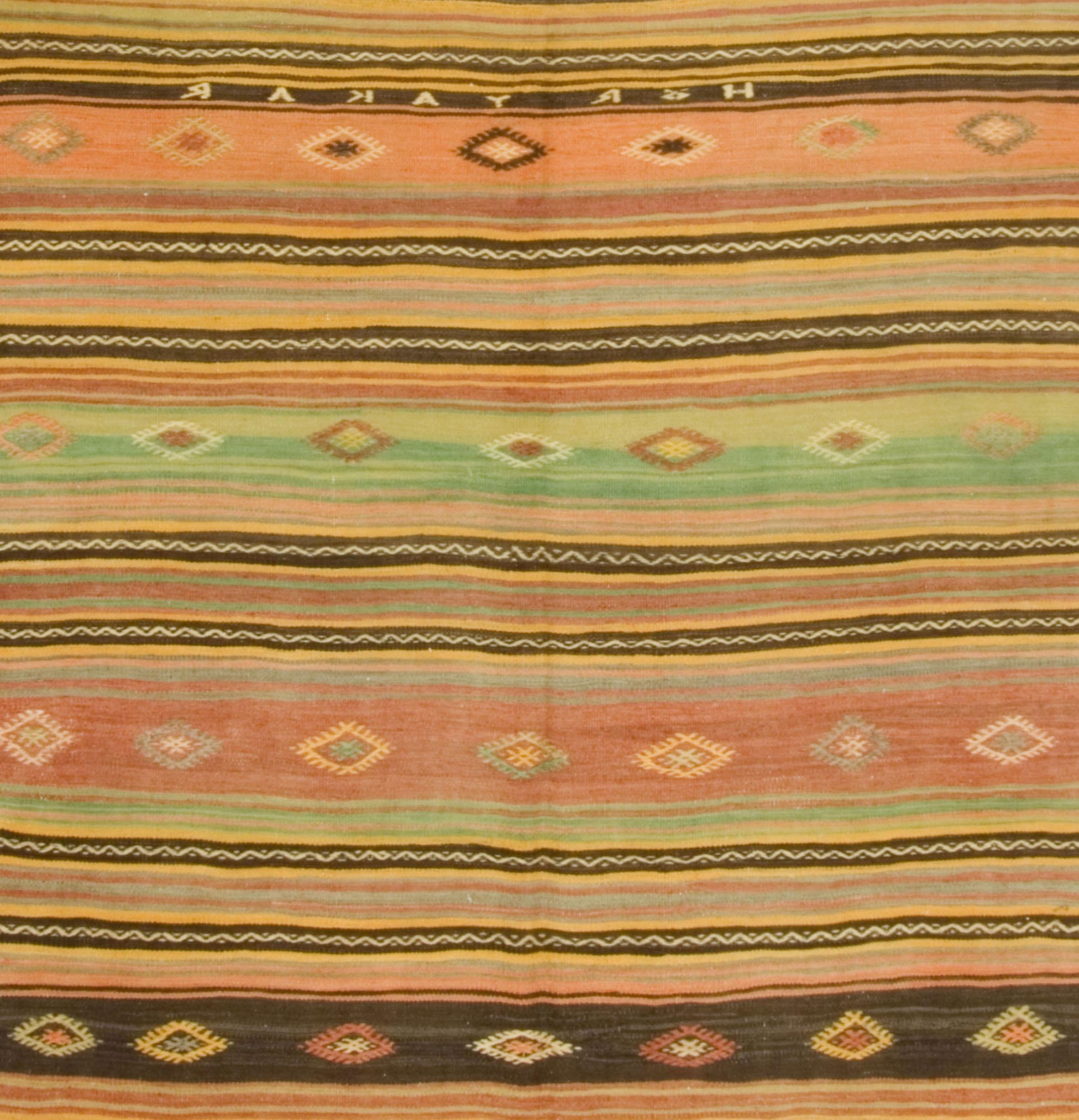 5'4 x 9'4. This vintage Turkish flat-weave Kilim was handwoven in the 1950's. The simplicity and boldness of these pieces can also give a contemporary feel and can look at home in both a modern or traditional setting.