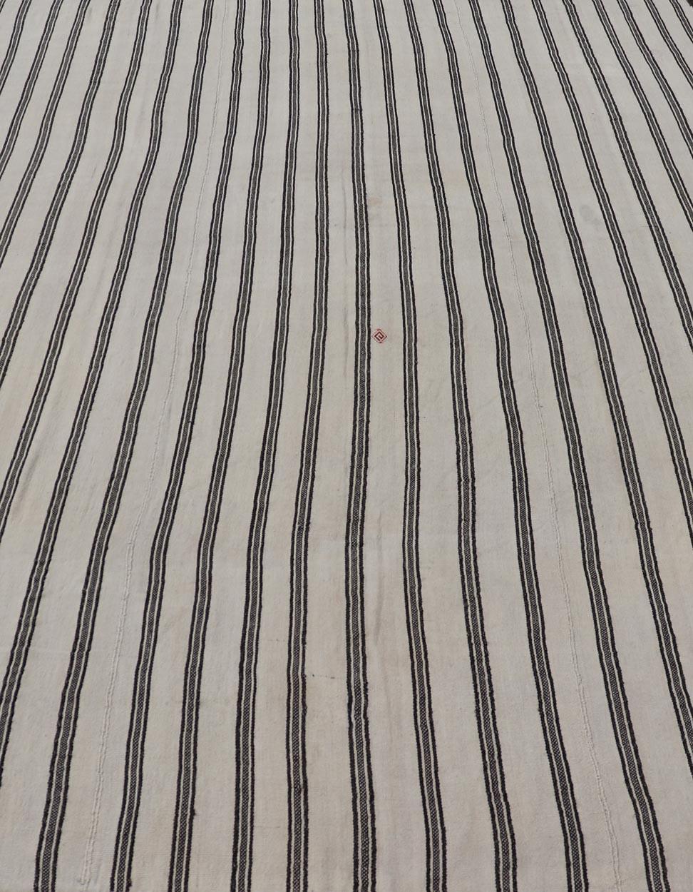 Measures: 8'3 x 12'7 Vintage Turkish Kilim Rug Classic Black and White Stripes and Accent Keivan Woven Arts / Rug / EN-15597 Country of origin / type: Turkey / Kilim 
Eelegant vintage Turkish kilim rug features a timeless design -classic black and