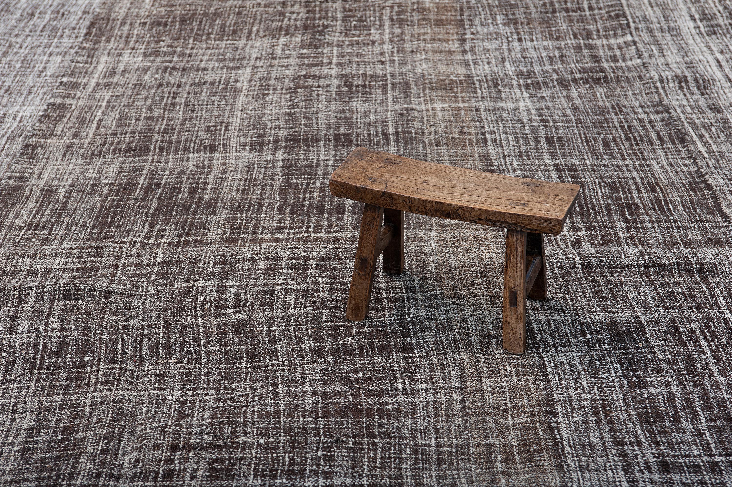 This is one spectacular Kilim with a modern design yet so elegant with its deep brown and beige color palette, created using natural un-dyed wool mixed with goat hair wherever dark brown was necessary. The ivory cream wool threats have been woven