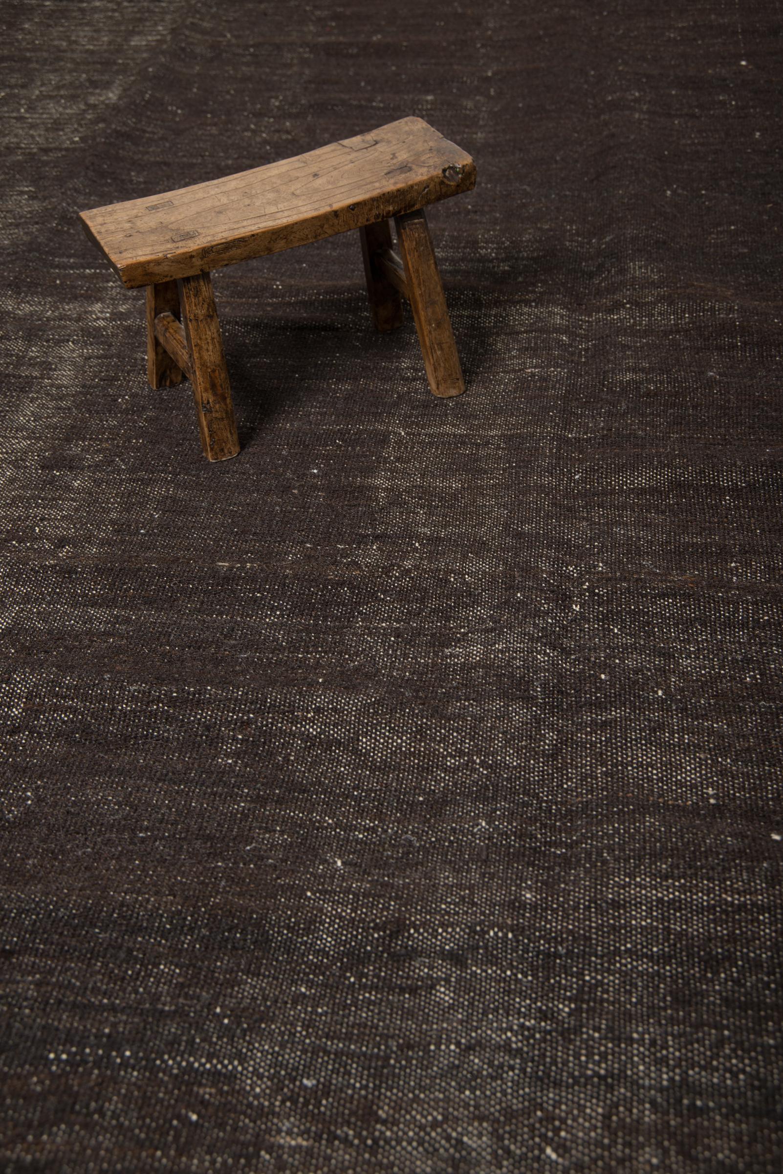 This vintage Kilim is simple in design yet so elegant with its deep dark brown an organic nature. This design captures both, elegance and raw beauty. Just unique and authentic. The most remarkable attribute about these types of Kilim is its own