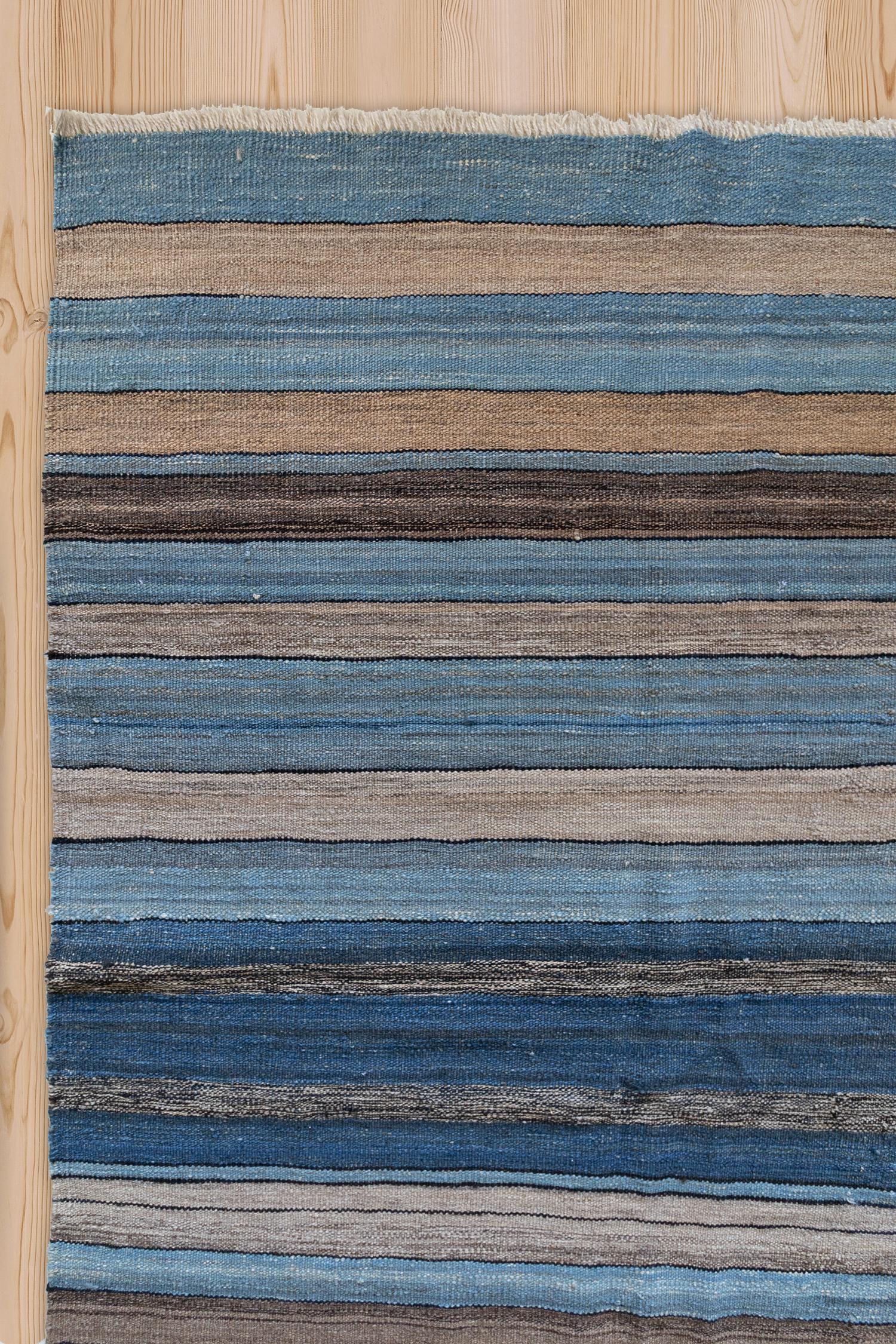 Age: Circa 1940

Colors: Blue, brown.

Pile: flatweave.

Material: hemp, wool.

Wear Notes: 1

Gorgeous flatweave rug in vibrant indigo, brown, caramel, and charcoal tones. 

Wear Guide:
Vintage and antique rugs are by nature, pre-loved