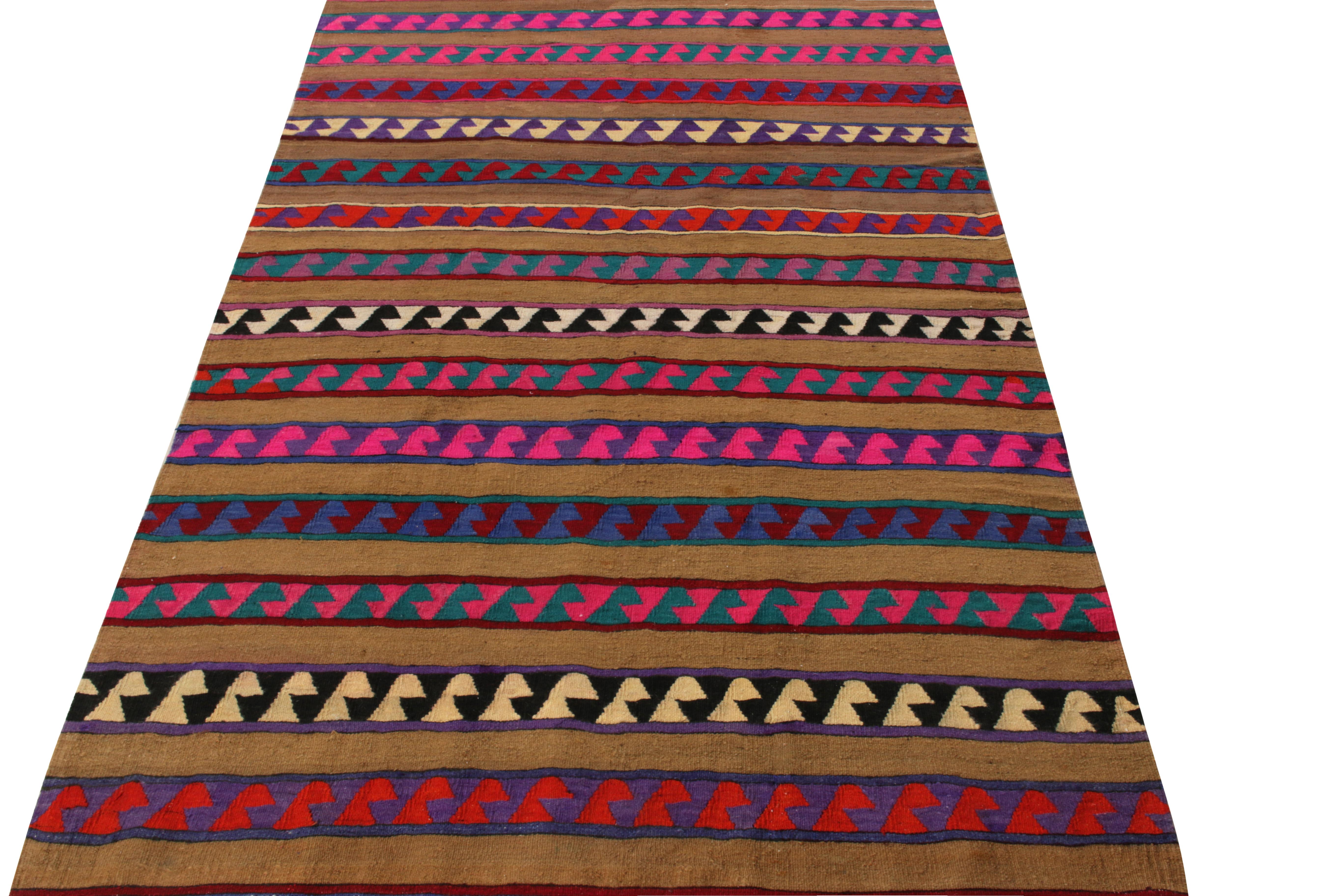 A joyful vintage rug showcasing nomadic sensibilities entering our Kilim & Flatweave collection. Originating from Turkey circa 1920-1930, the piece features tribal motifs embedded in kaleidoscopic pink and blue striations enjoying an amusing