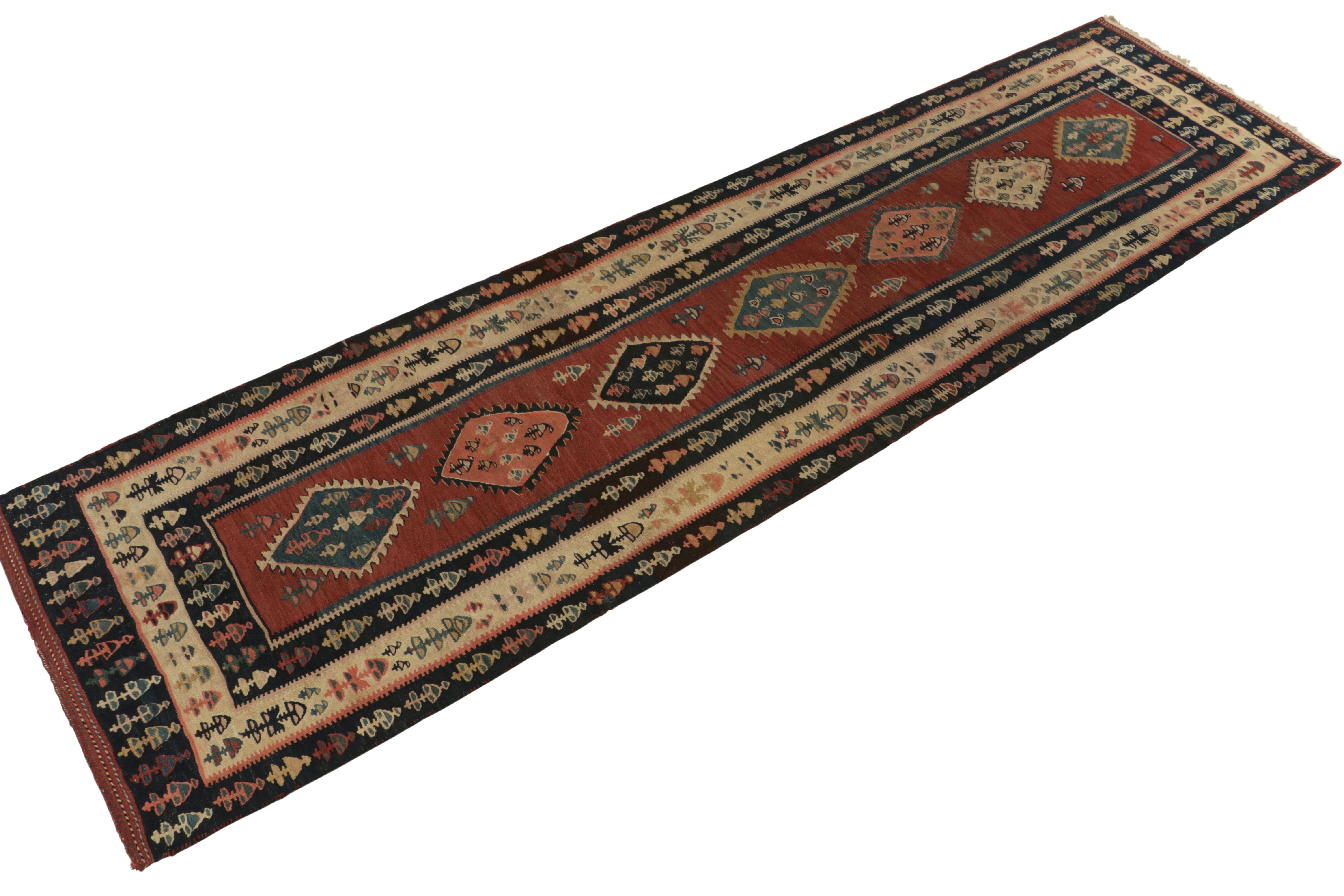 Handwoven in wool, a 4x12 Kilim rug from our vintage selections. Originating from Turkey circa 1950-1960, the mid-century aesthetics seep through motifs & patterns relishing a shabby chic vibe with beige-brown, black and whimsical hues against a