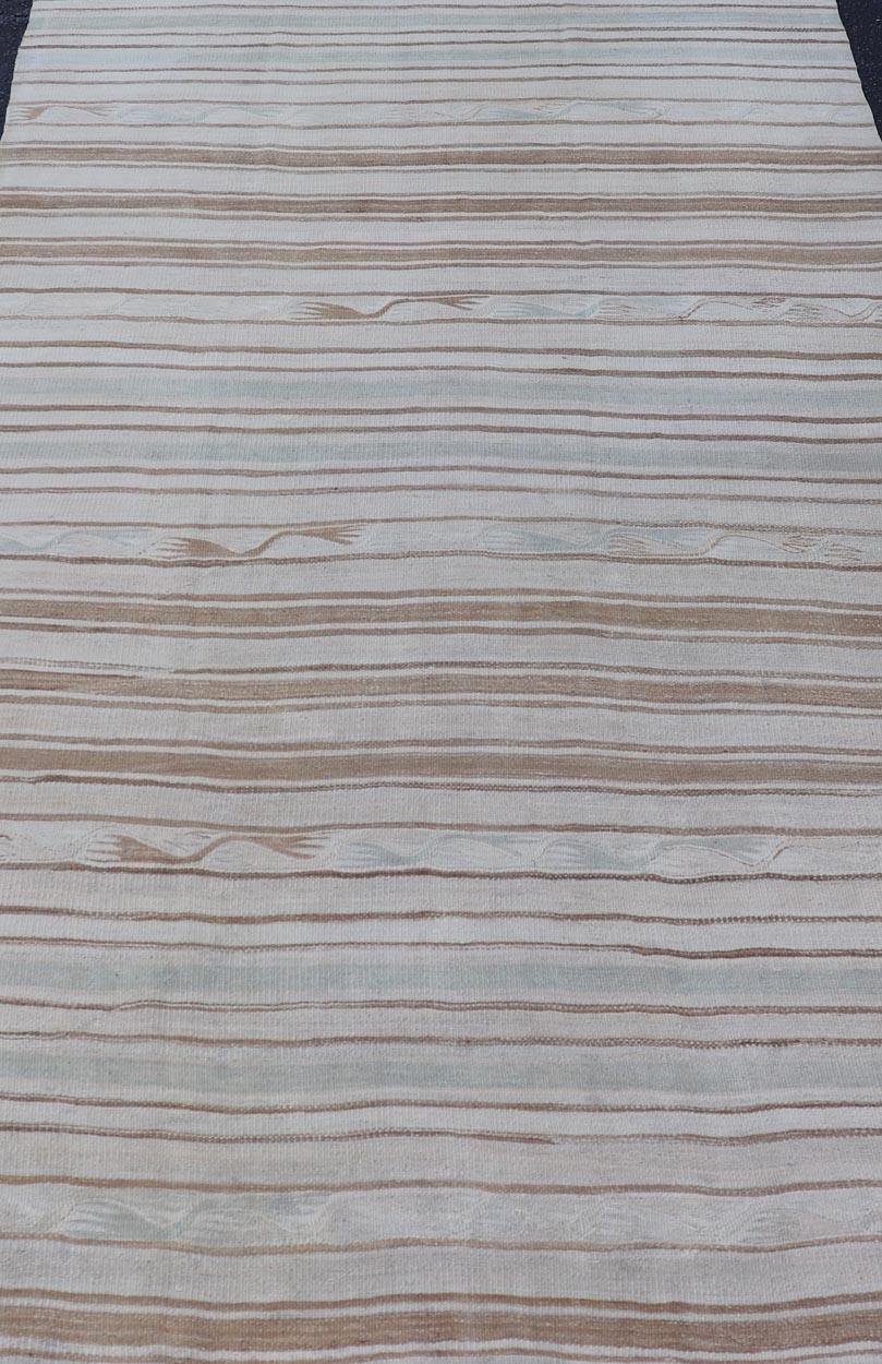 Measures: 4'7 x 7'10 

Vintage Turkish Kilim Rug In Soft Cream and Beige Stripes 4'7 x 7'10 
Keivan Woven Arts / Rug / EN-13203 Country of origin / type: Turkey / Kilim 

This Vintage Turkish Kilim Rug exemplifies timeless elegance, featuring a