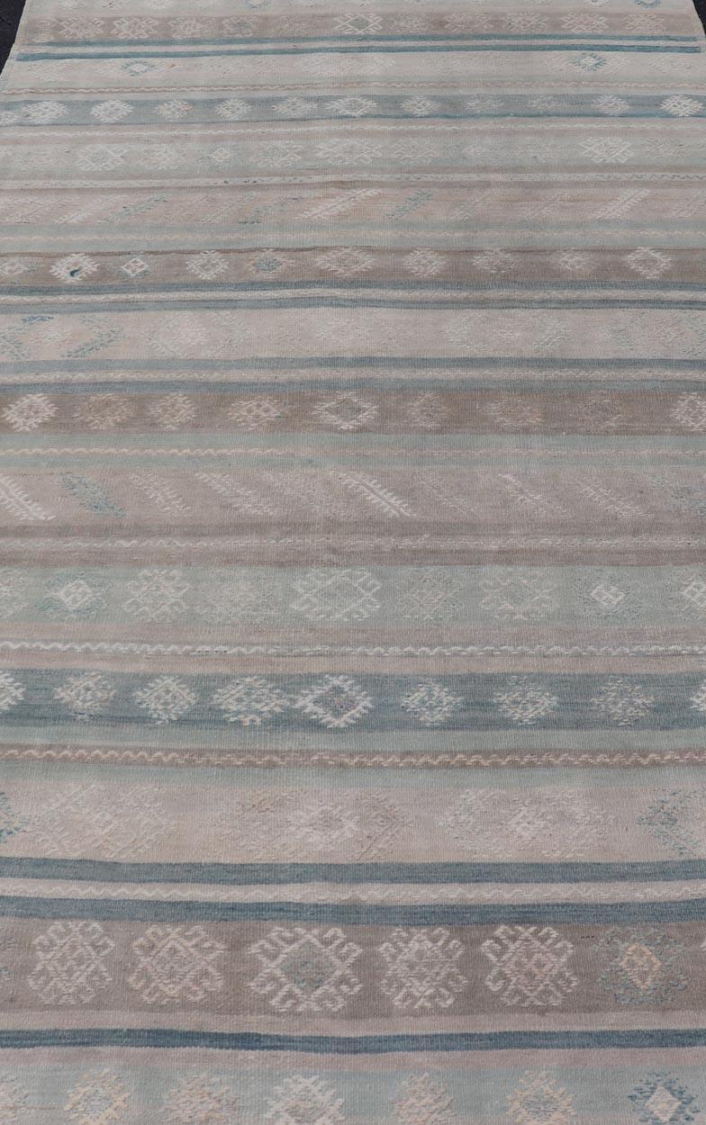 Measures: 5'3 x 9'9 
Vintage Turkish Kilim Rug In Soft Pastel Stripes and Geometric Patten 5'3 x 9'9. Keivan Woven Arts / Rug / EN-15612 Country of origin / type: Turkey / Kilim 
Vintage Turkish kilim rug is a testament to the rich heritage and